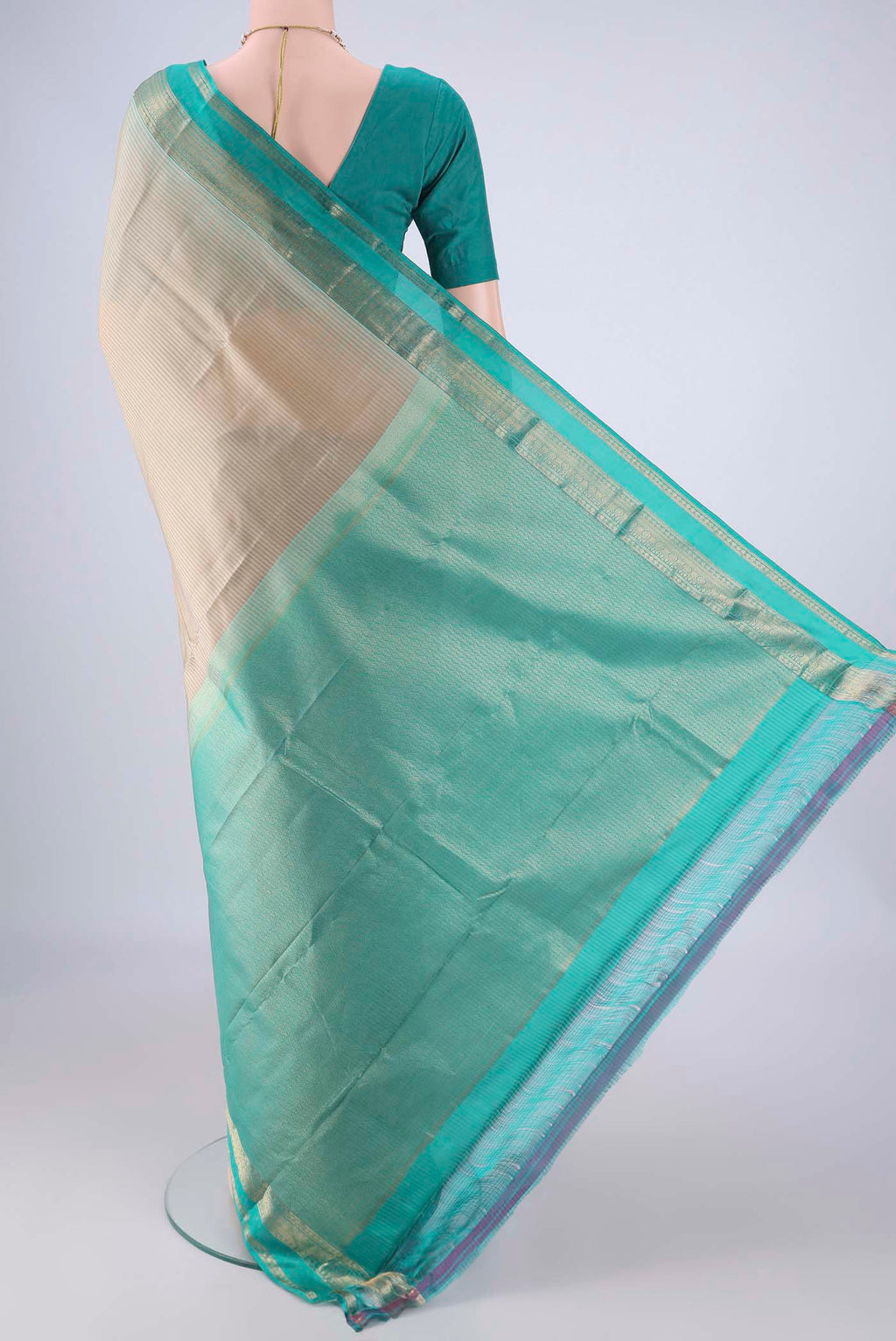 Flat view of Beige Kanchipuram Silk Saree with Stripes on the body and Zari Border. 