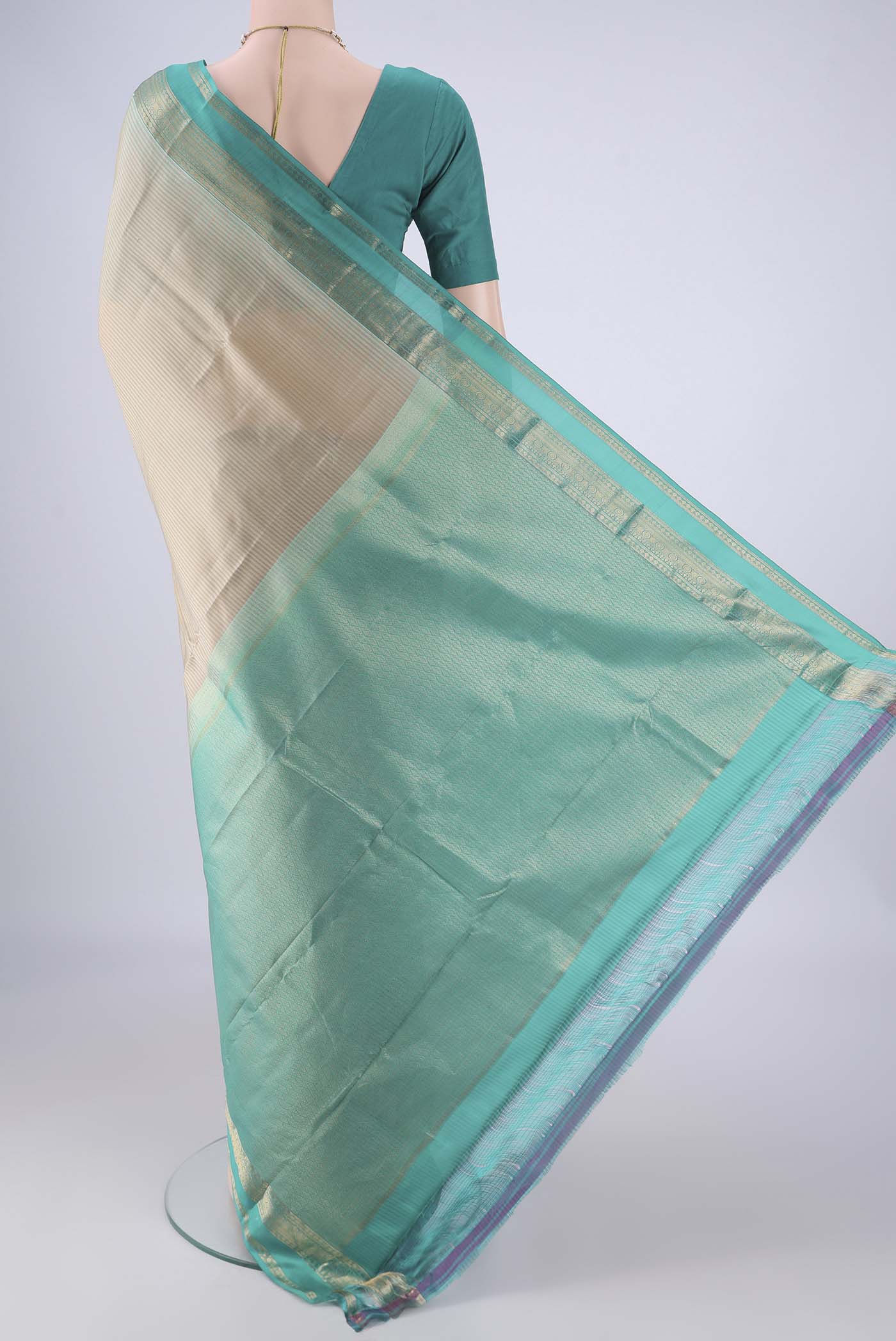 Flat view of Beige Kanchipuram Silk Saree with Stripes on the body and Zari Border. 