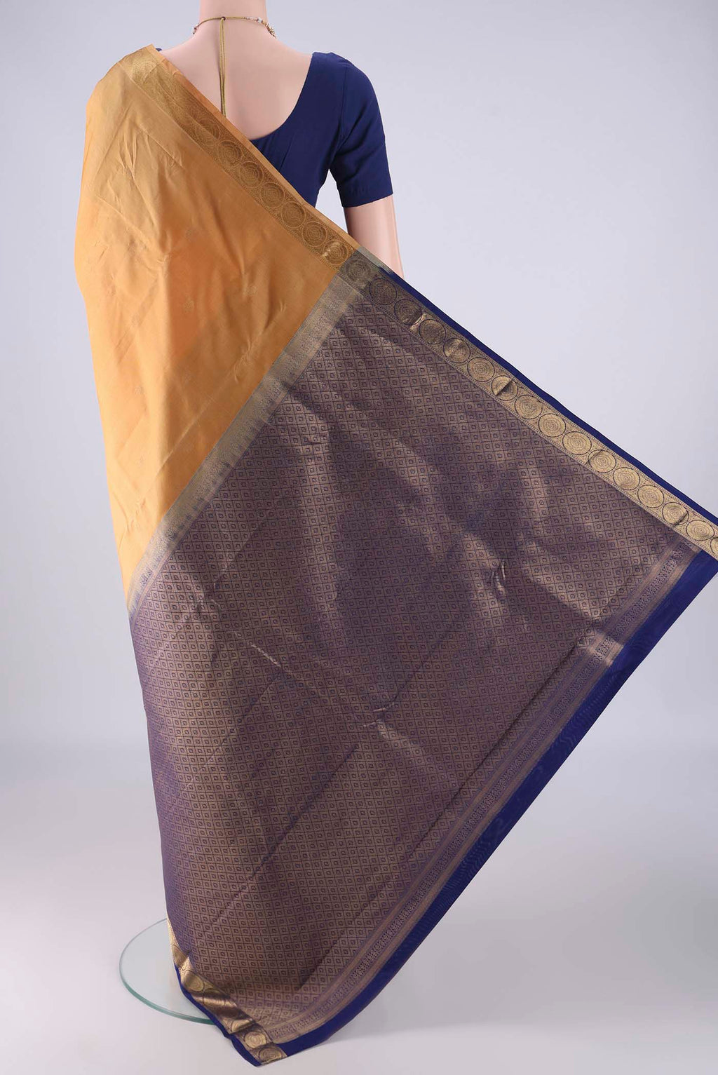 Flat view of Sandal Kanchipuram Silk Saree with Zari Butta on the body and Zari Border. 