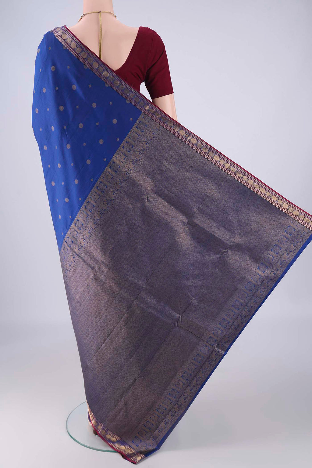 Flat view of Dark Blue Kanchipuram Silk Saree with Zari Butta on the body and Zari Border. 