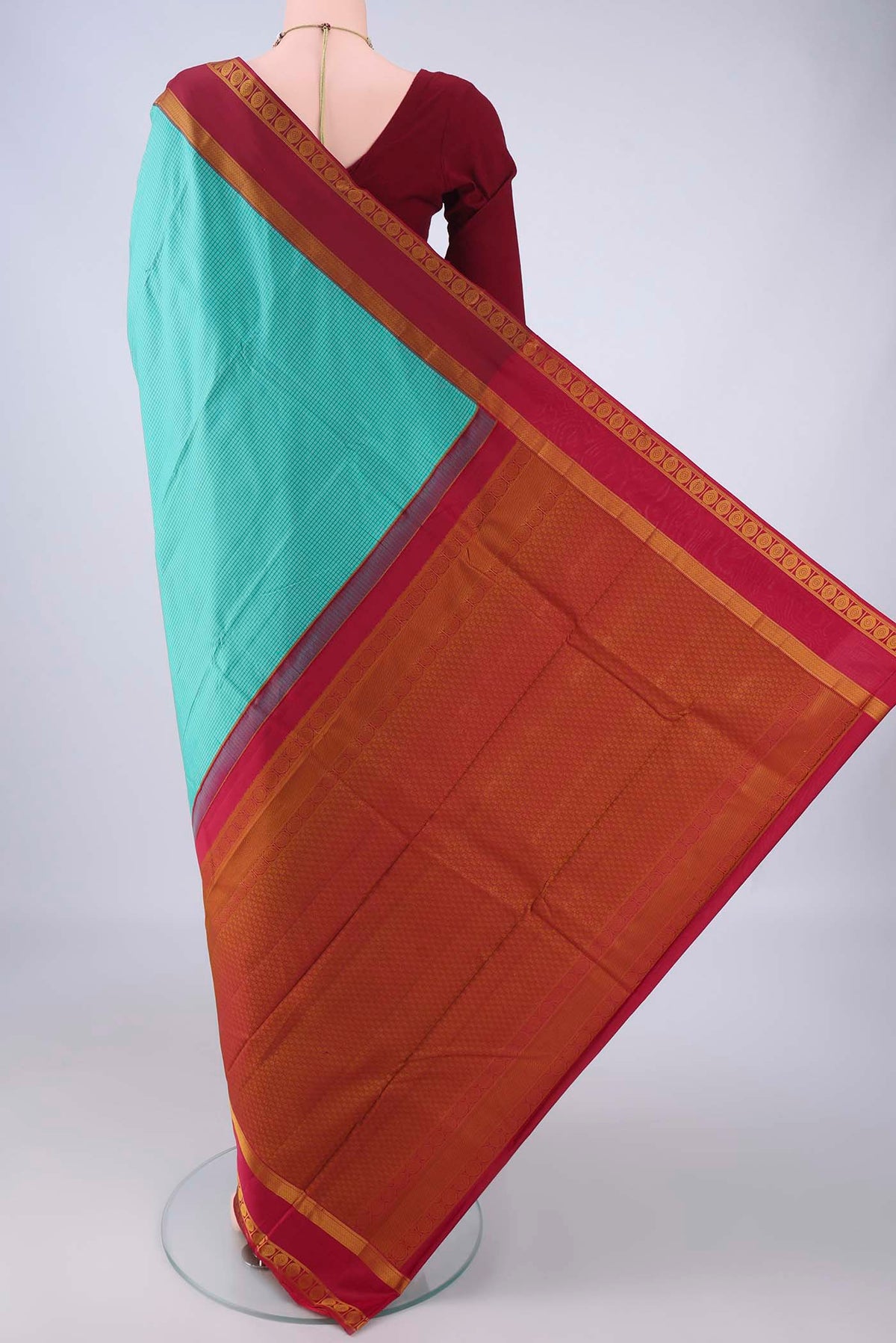 Flat view of Turquoise Kanjivaram Silk Saree with Checked design on the body and Thread Border. 
