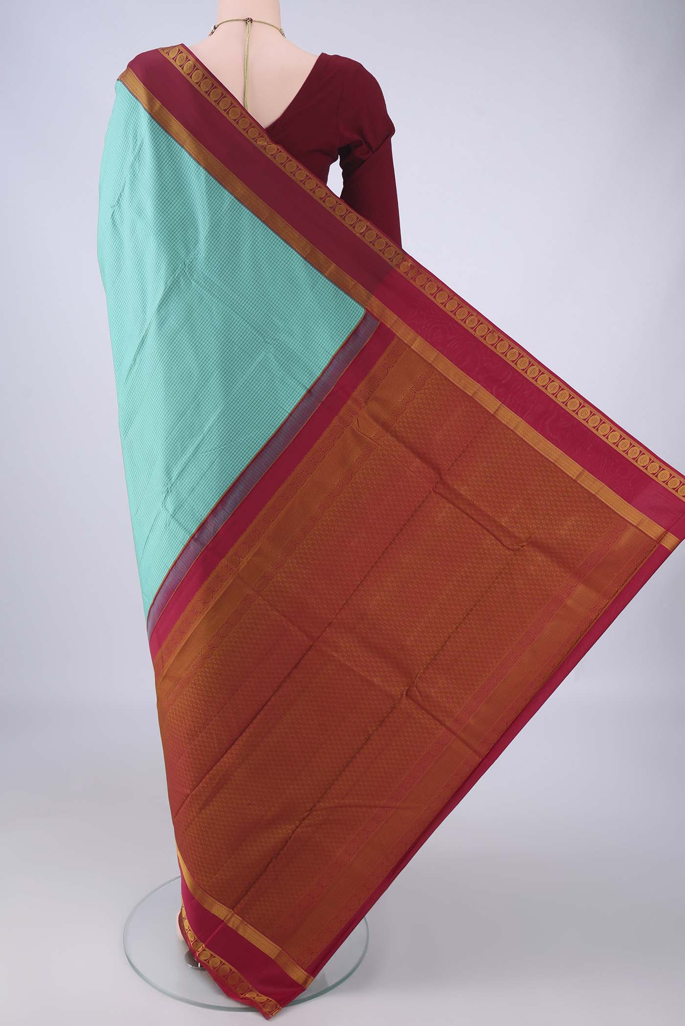Flat view of Turquoise Kanjivaram Silk Saree with Checked design on the body and Thread Border. 
