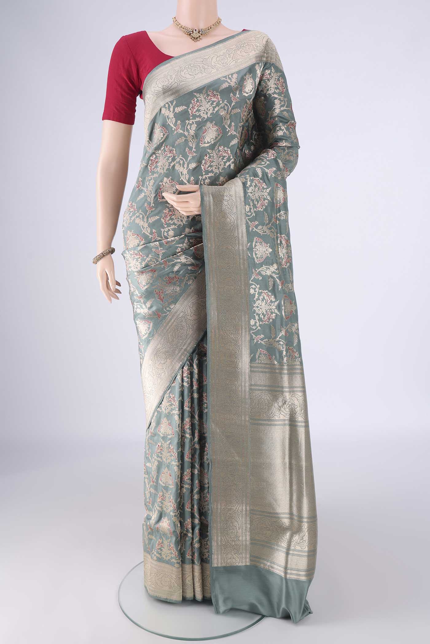 Grey Banarasi Silk Saree with Zari Brocade on the body and Zari Border.  displayed on a mannequin