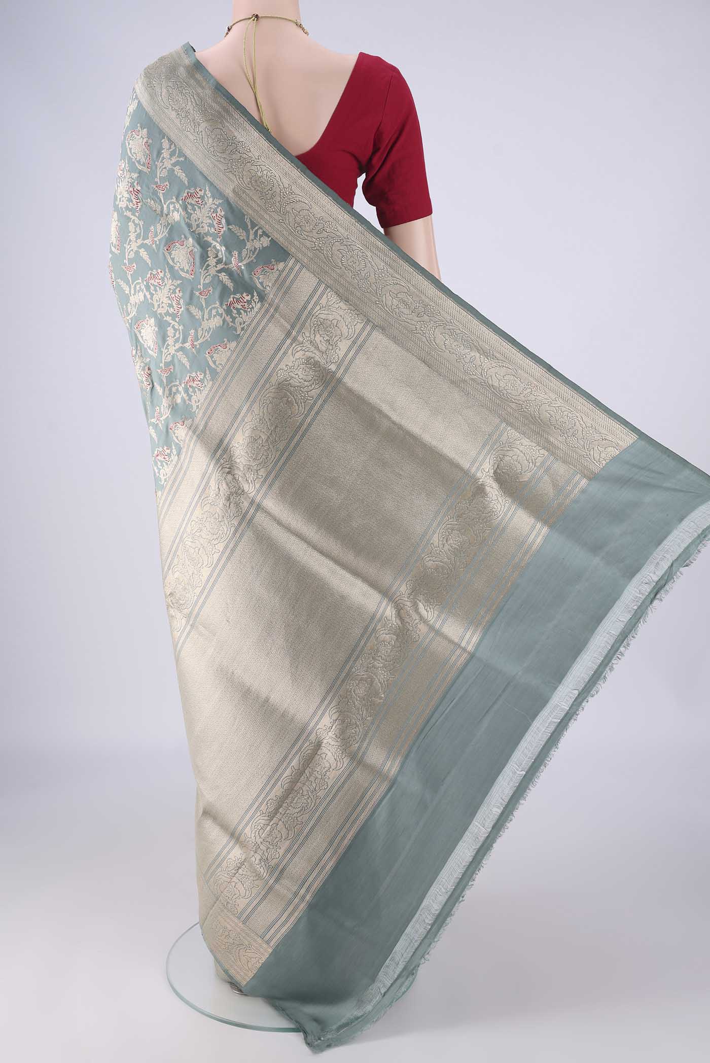 Flat view of Grey Banarasi Silk Saree with Zari Brocade on the body and Zari Border. 