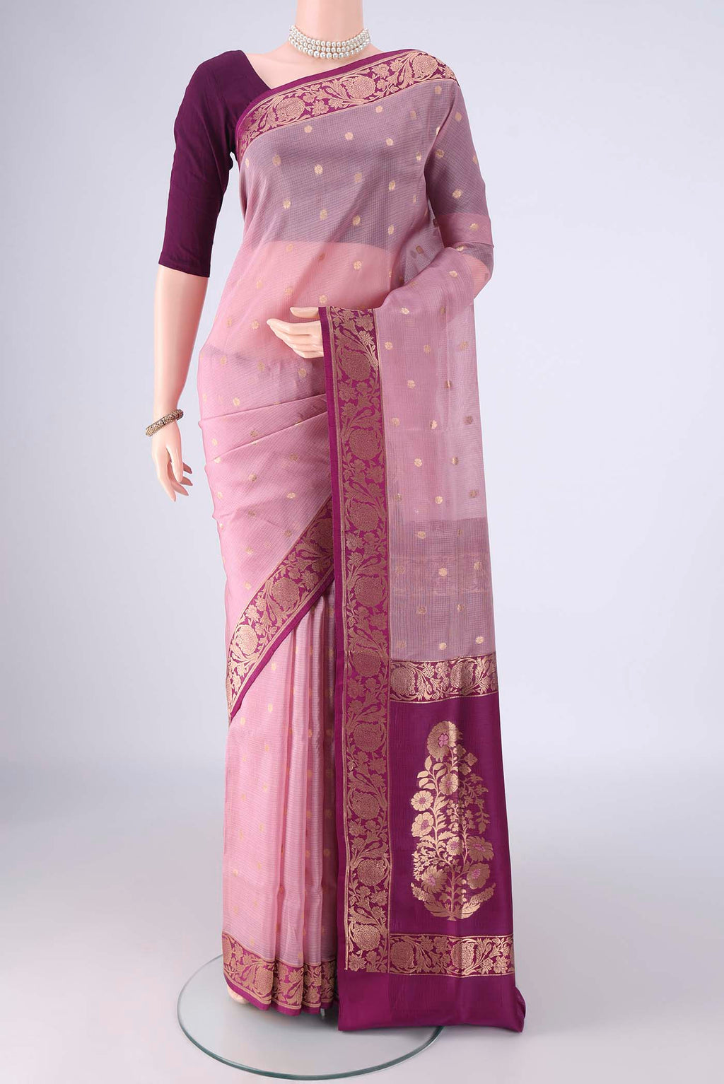 Rose Gold Banarasi Silk Saree with Zari Butta on the body and Zari Border.  displayed on a mannequin