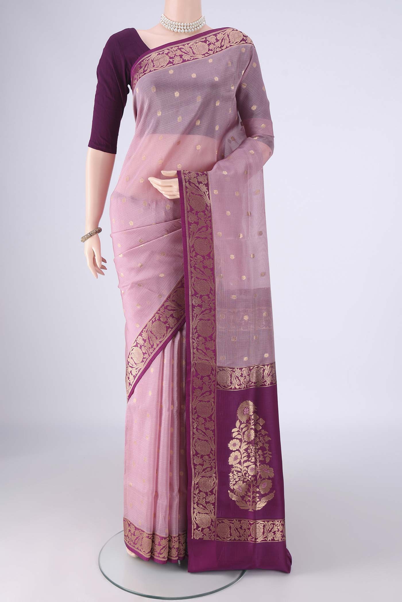 Rose Gold Banarasi Silk Saree with Zari Butta on the body and Zari Border.  displayed on a mannequin