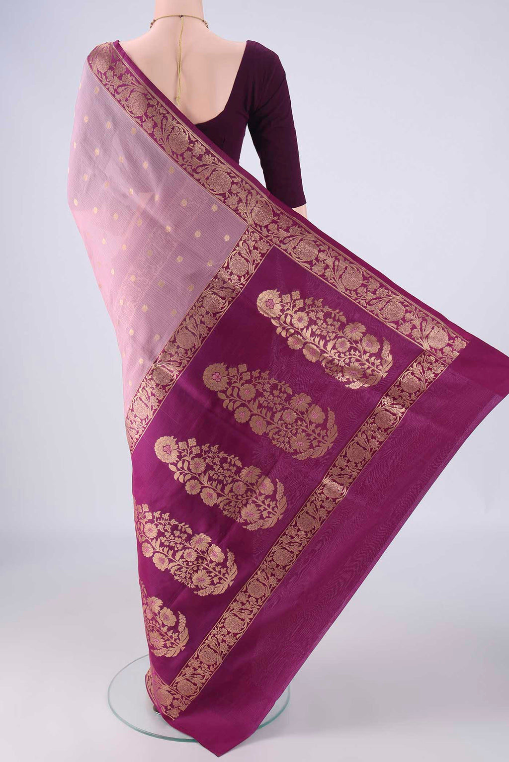 Flat view of Rose Gold Banarasi Silk Saree with Zari Butta on the body and Zari Border. 