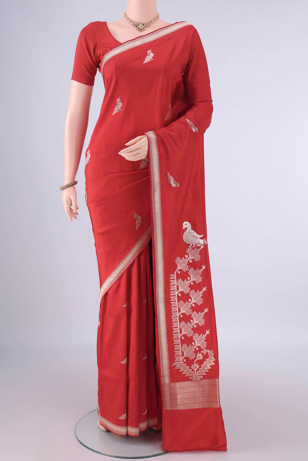 Pure Silk Red Banarasi Saree with Zari Butta on the body and Zari Border.  displayed on a mannequin