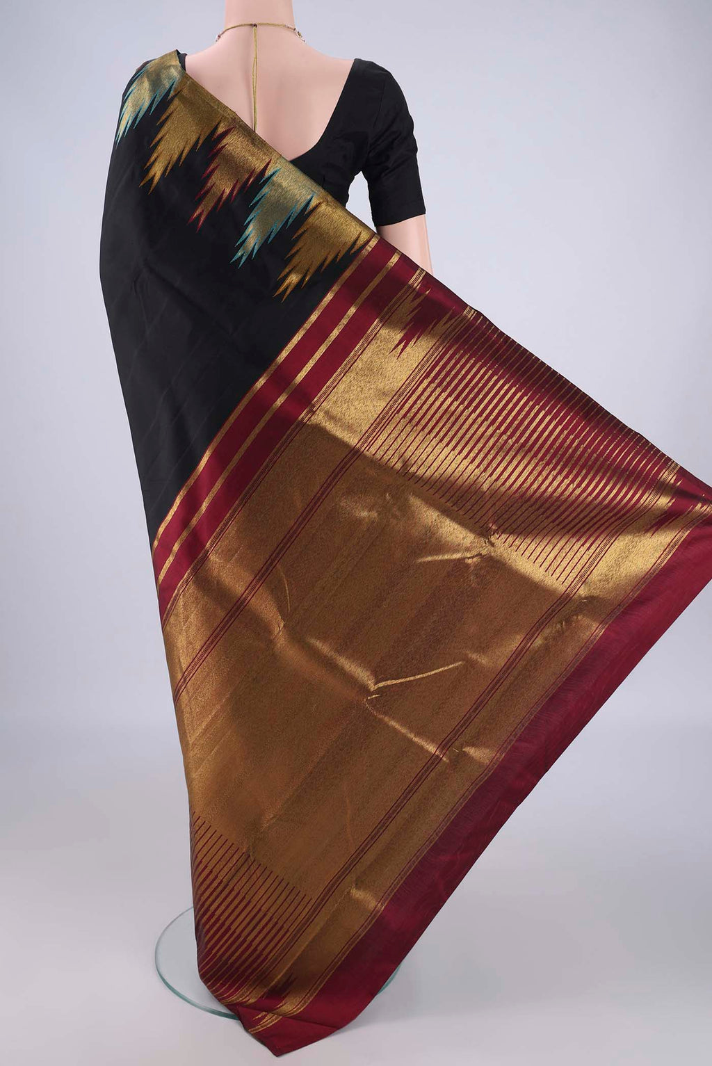 Flat view of Black Kanjivaram Silk Saree with Plain Body and Temple Border. 