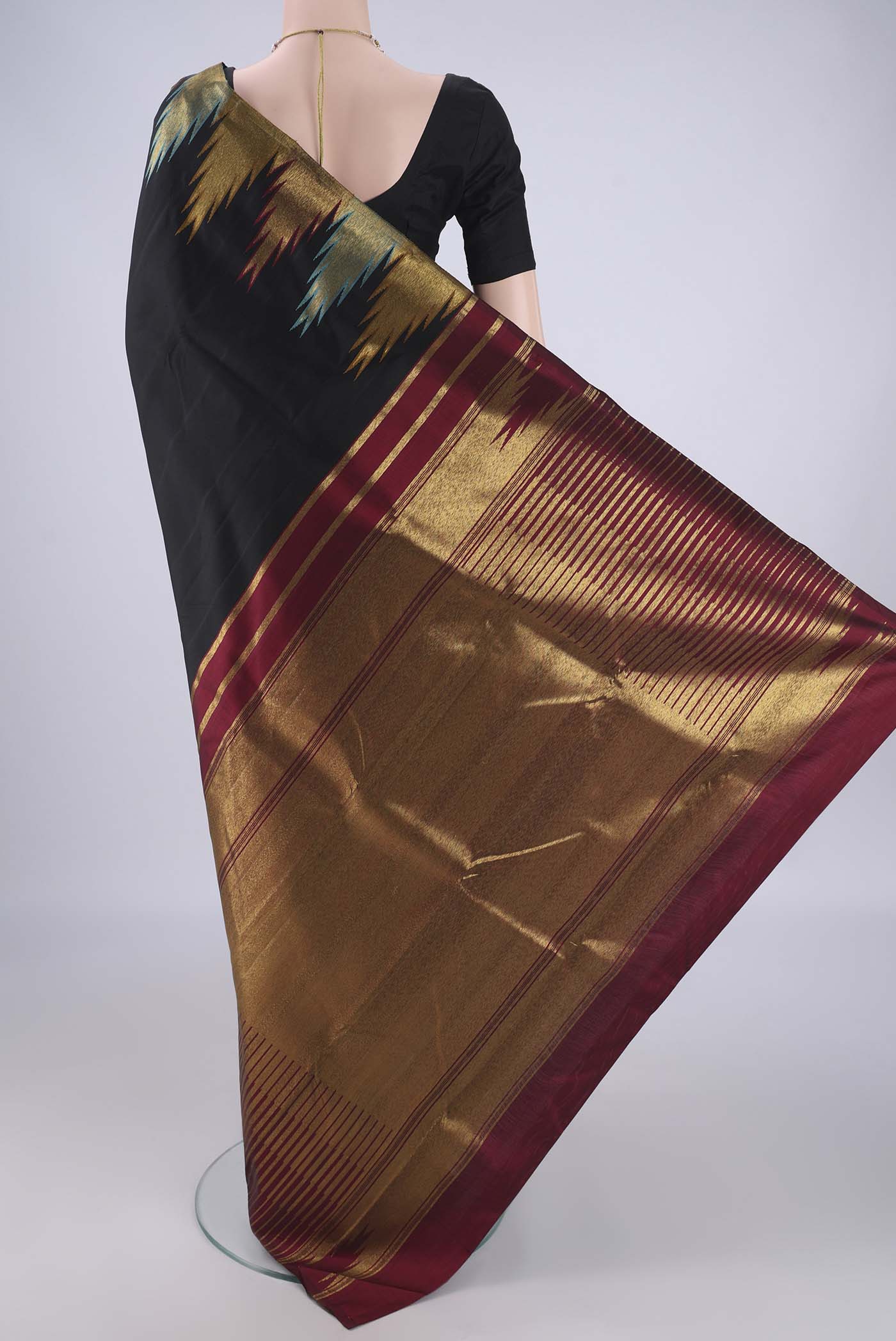 Flat view of Black Kanjivaram Silk Saree with Plain Body and Temple Border. 