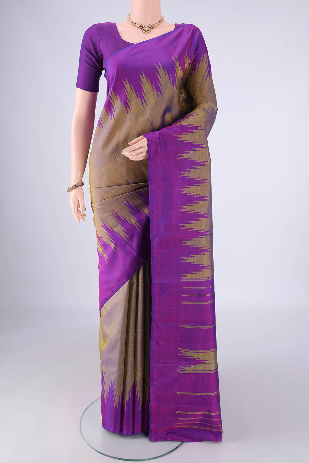 Mehandi Green Kanchipuram Silk Saree with Plain Body and Temple Border.  displayed on a mannequin
