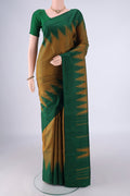 Mehandi Green Kanchipuram Silk Saree with Plain Body and Temple Border.  displayed on a mannequin