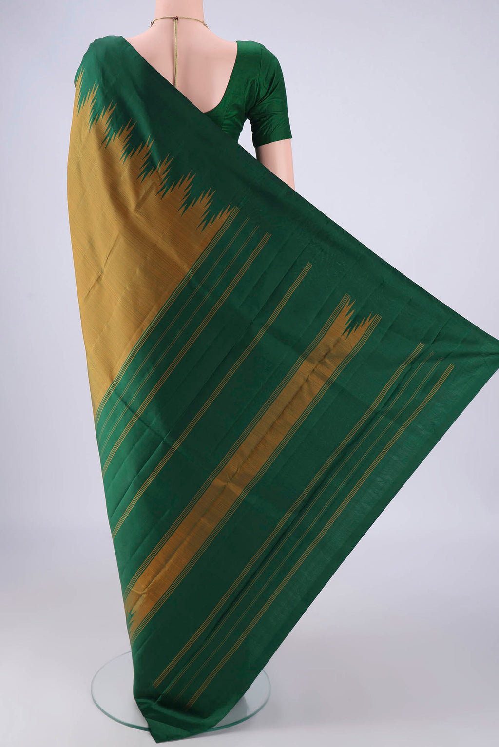 Flat view of Mehandi Green Kanchipuram Silk Saree with Plain Body and Temple Border. 
