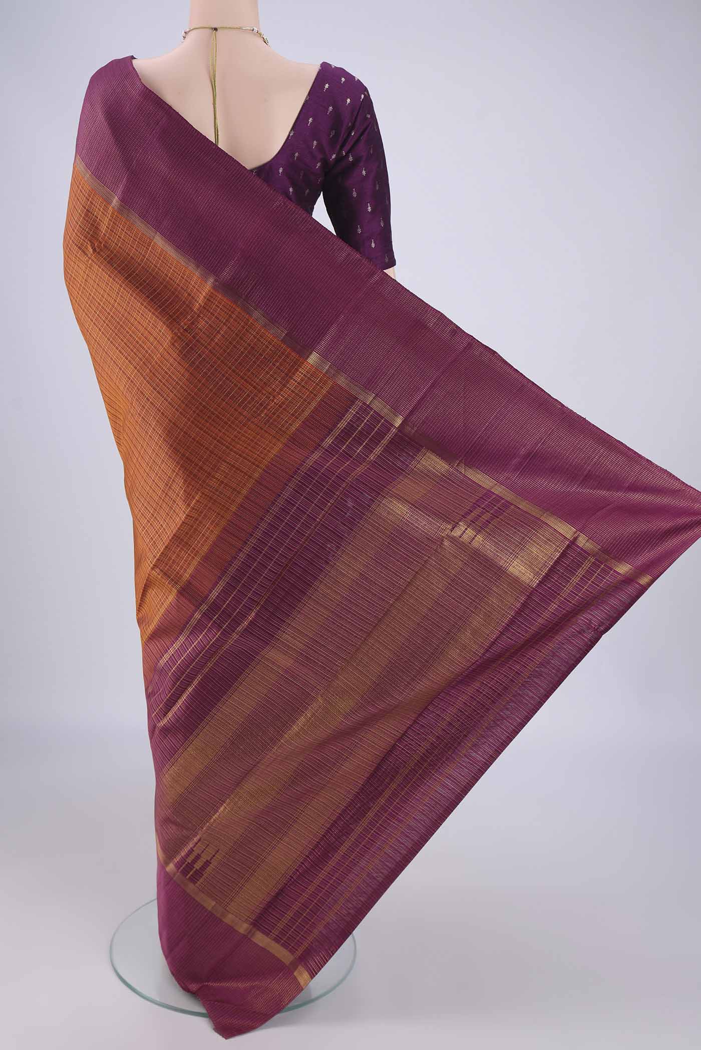 Flat view of Bottle Green Kanjivaram Silk Saree with Zari Brocade on the body and Checks Border. 