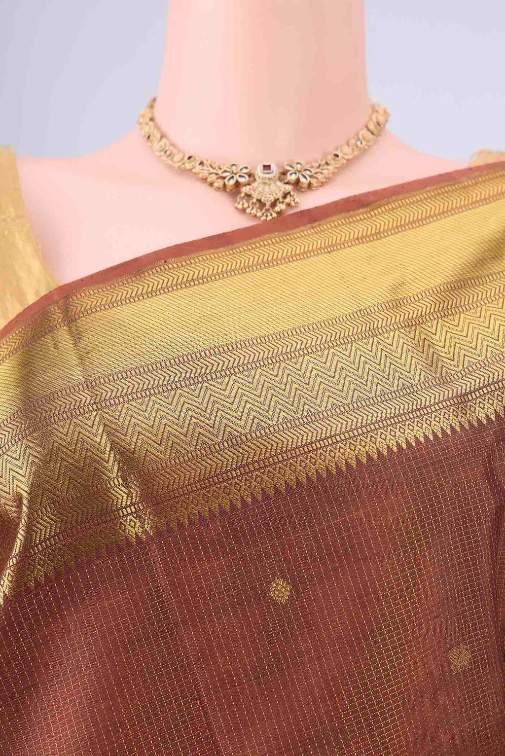 Border image of Brown Kanchipuram Silk Saree with Checked design on the body and Zari Border. 