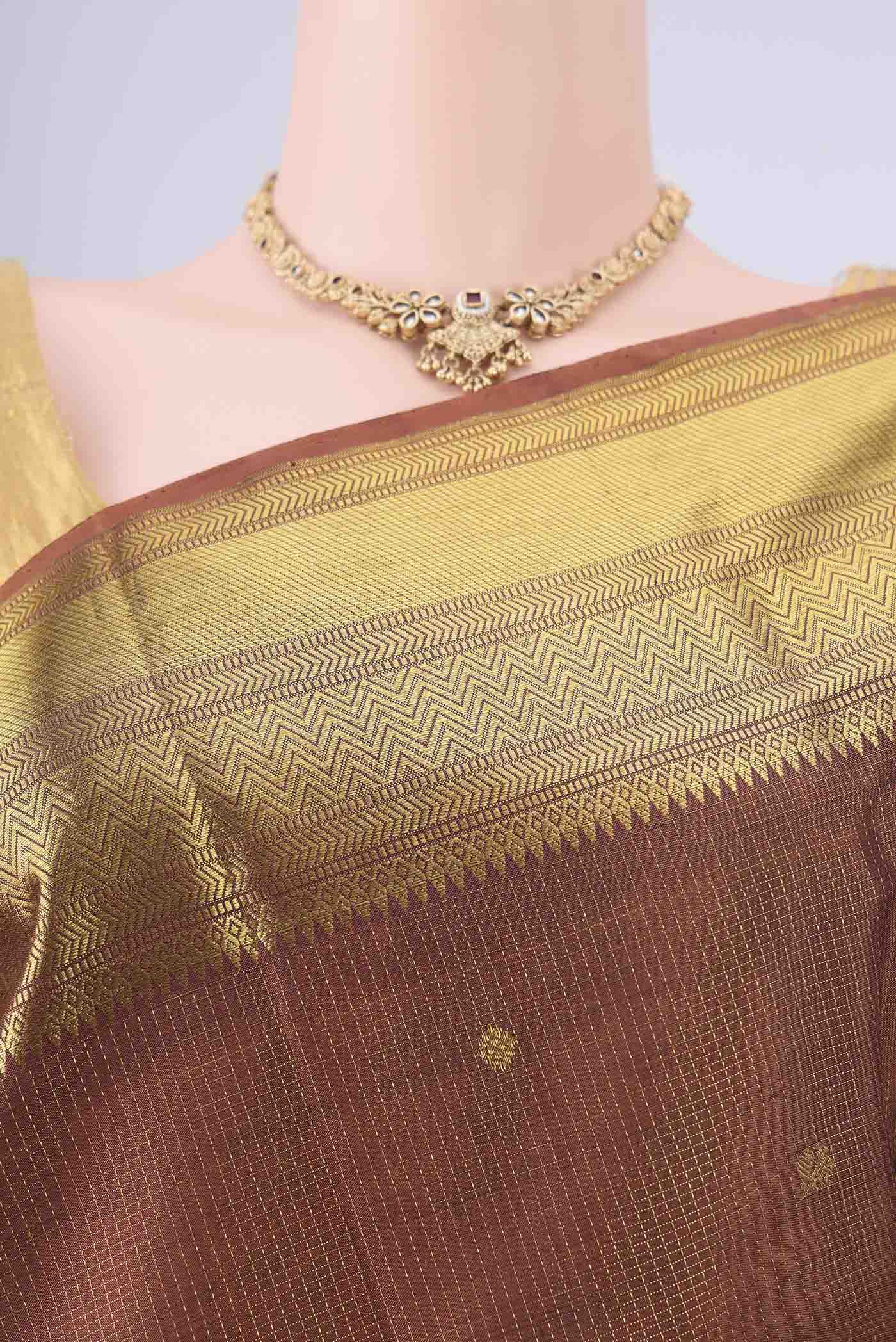 Border image of Brown Kanchipuram Silk Saree with Checked design on the body and Zari Border. 