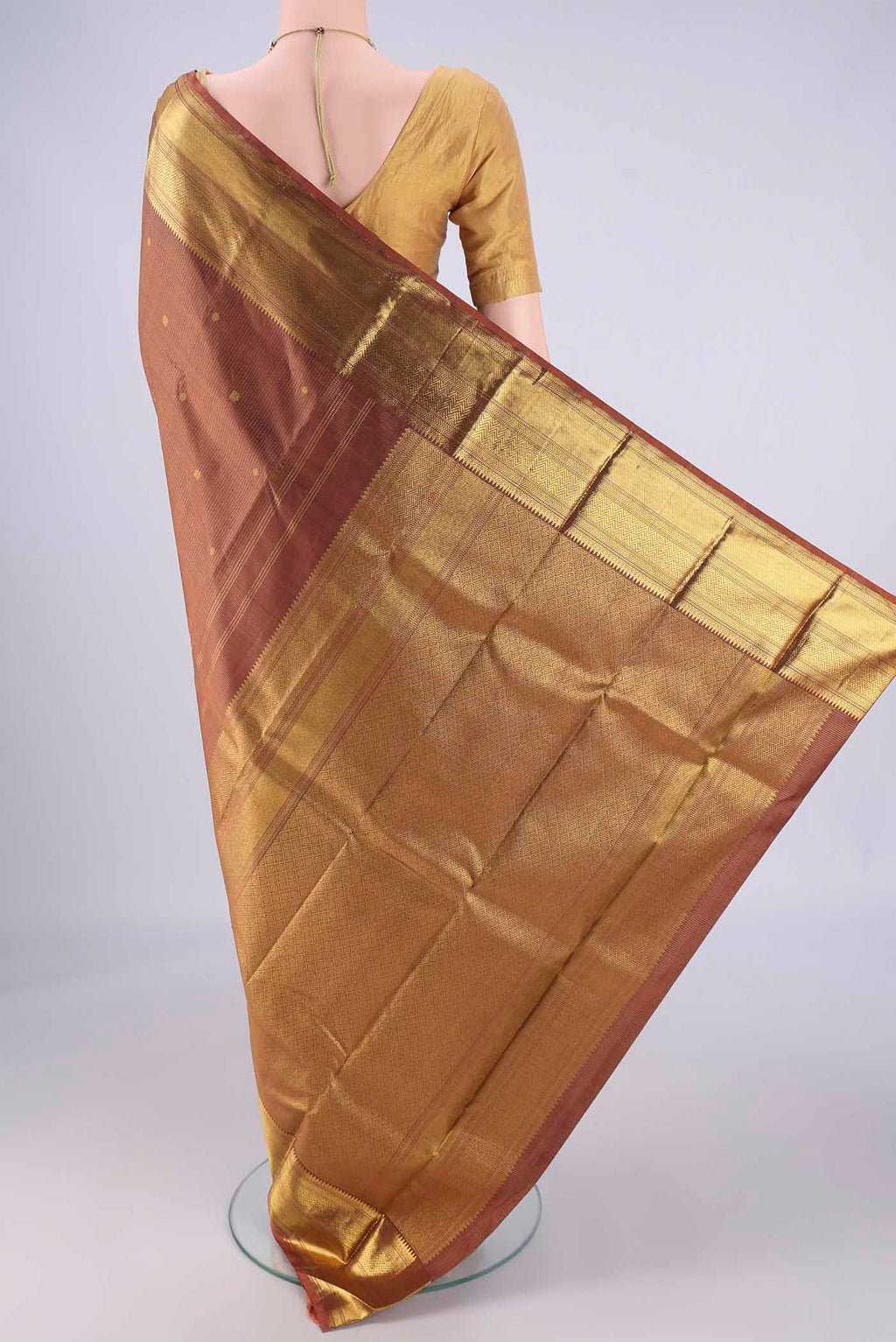 Flat view of Brown Kanchipuram Silk Saree with Checked design on the body and Zari Border. 
