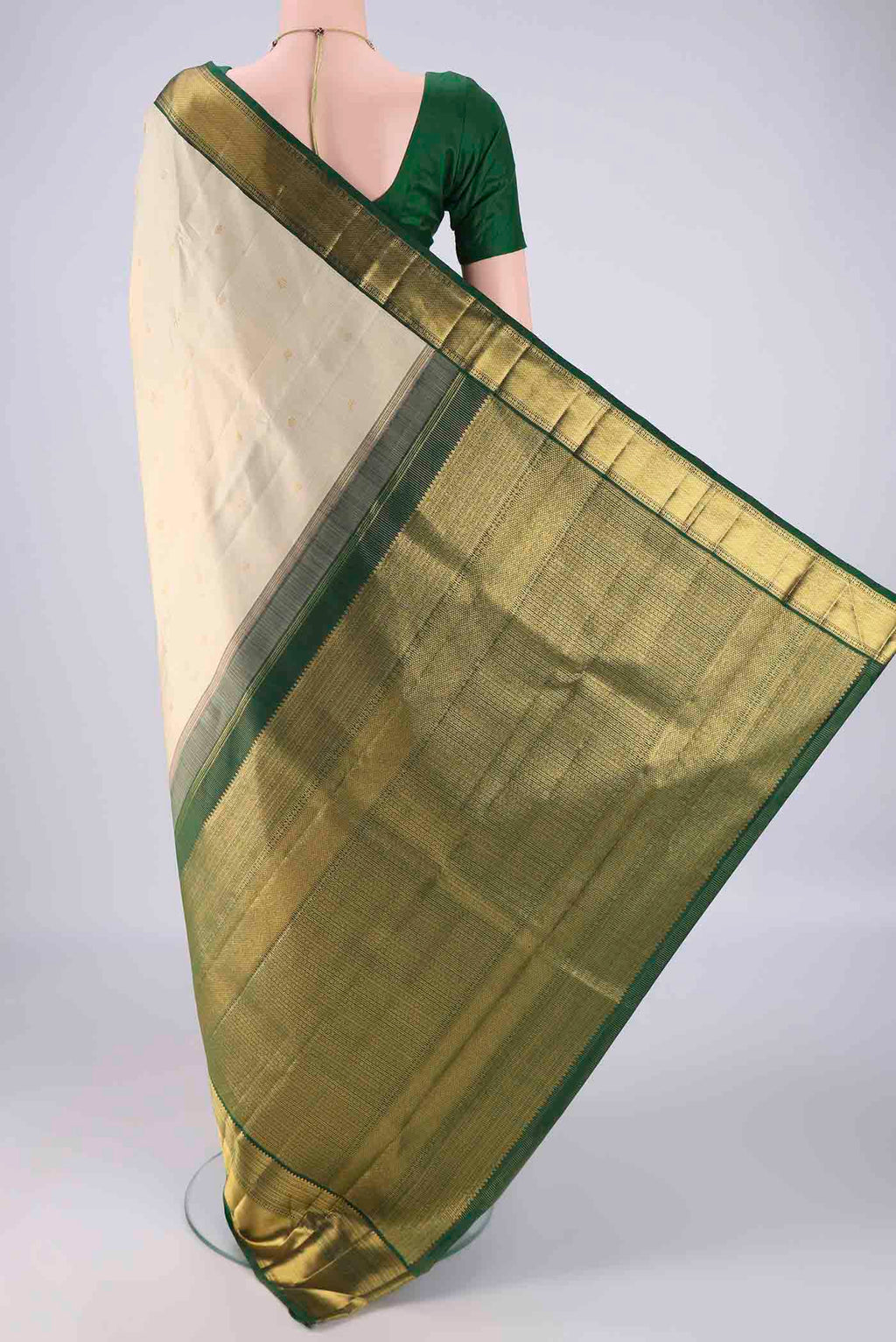 Flat view of Cream Kanchipuram Silk Saree with Checked design on the body and Zari Border. 