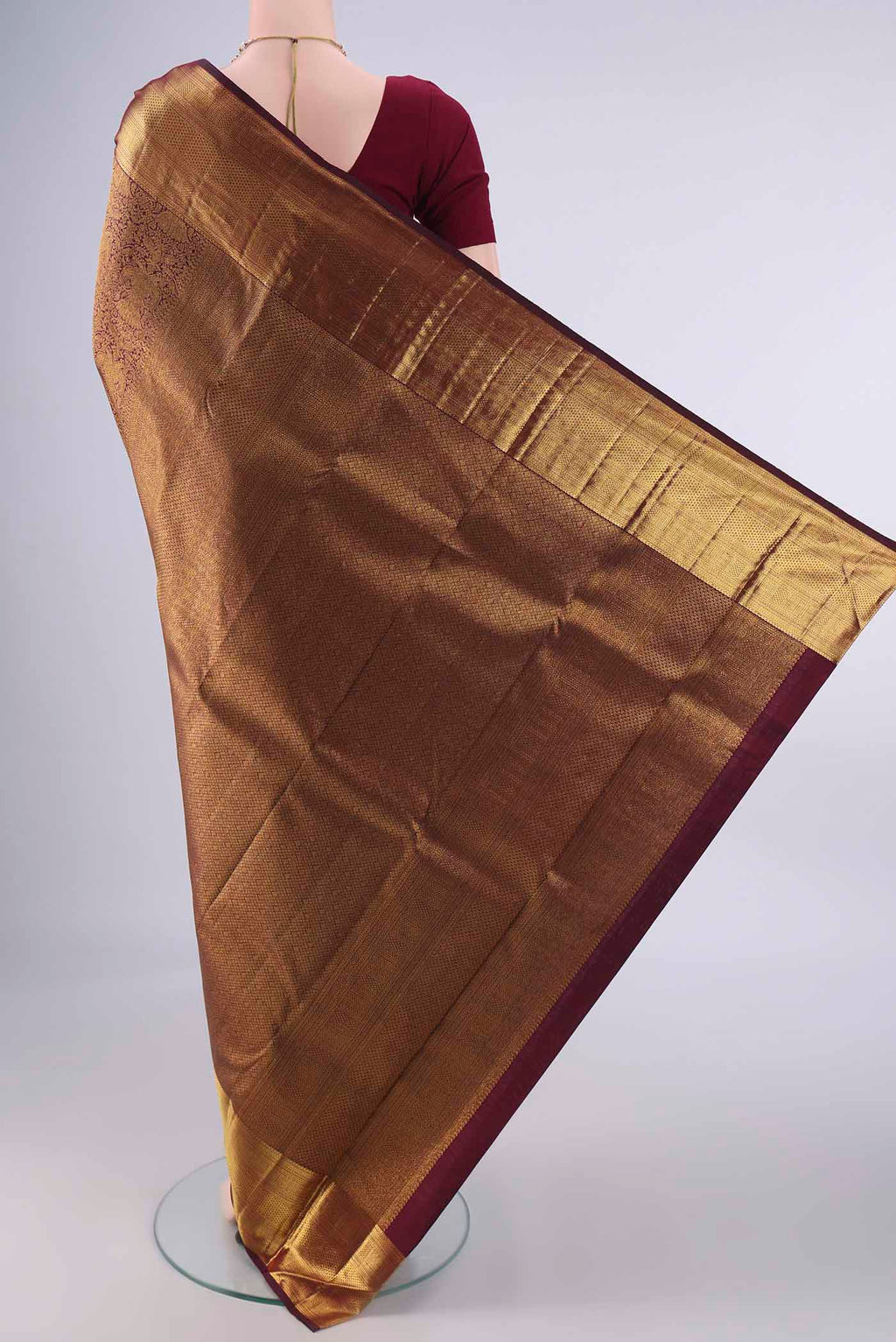 Flat view of Pure Silk Maroon Kanchipuram Saree with Zari Brocade on the body and Zari Border. 
