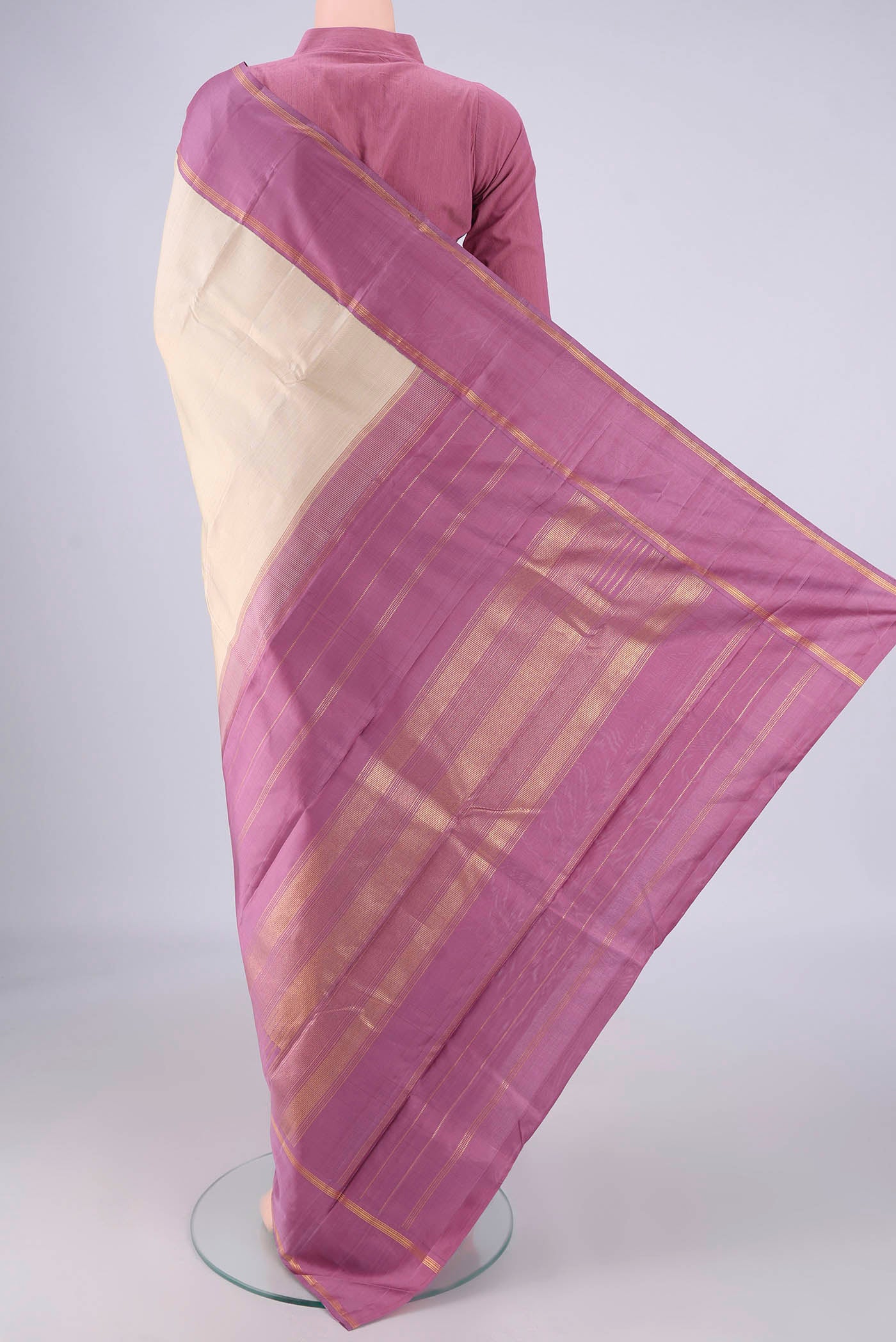 Flat view of Cream Kanjivaram Silk Saree with Plain Body and Plain Border. 