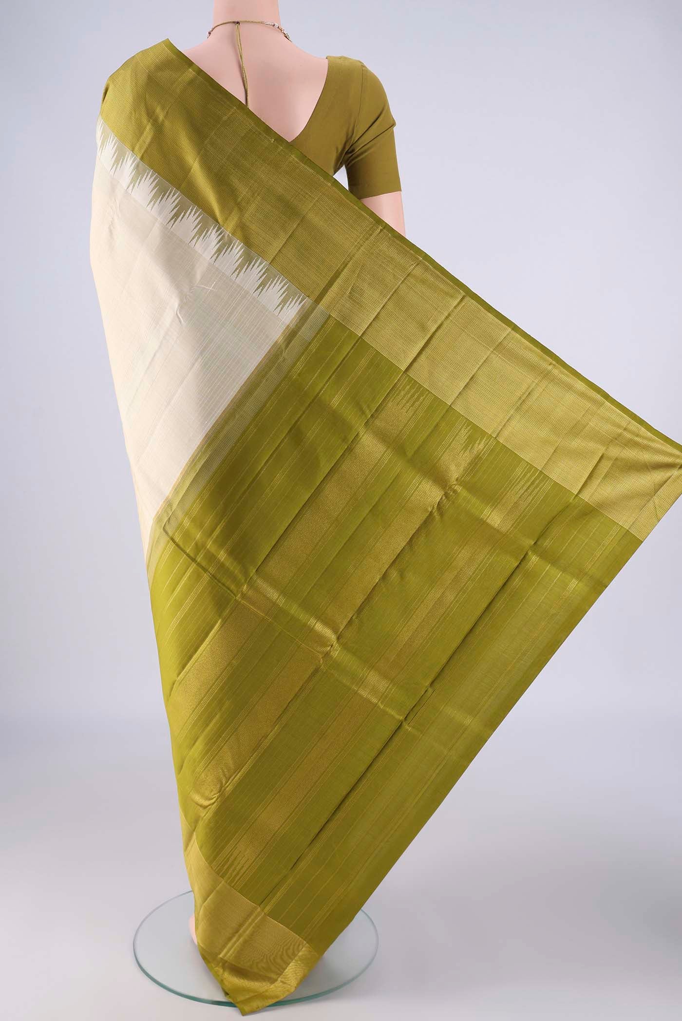 Flat view of Off White Kanjivaram Silk Saree with Plain Body and Temple Border. 