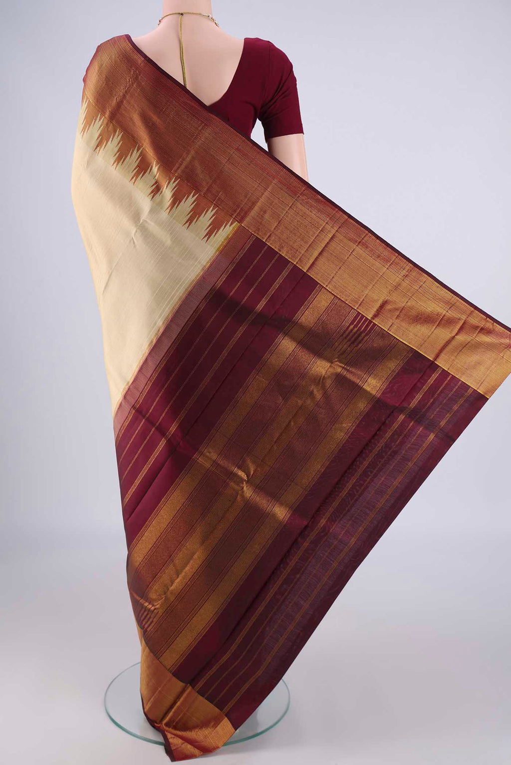 Flat view of Beige Kanjivaram Silk Saree with Plain Body and Temple Border. 