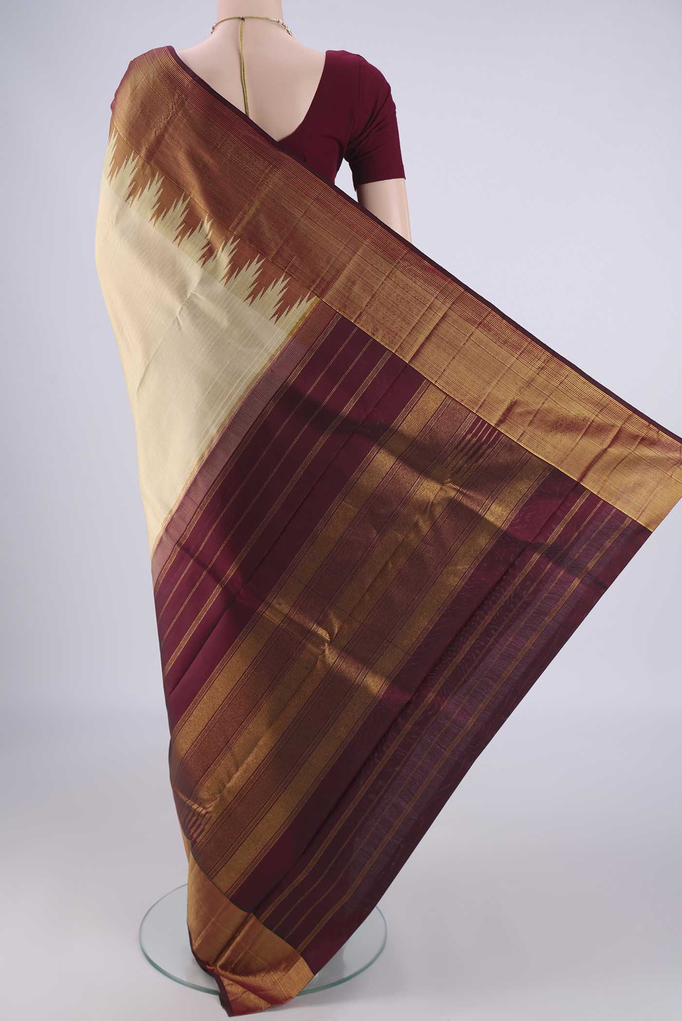 Flat view of Beige Kanjivaram Silk Saree with Plain Body and Temple Border. 