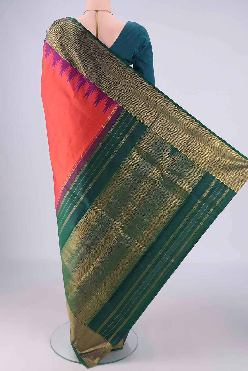 Flat view of Brick Orange Dual Tone Kanjivaram Silk Saree with Plain Body and Temple Border. 