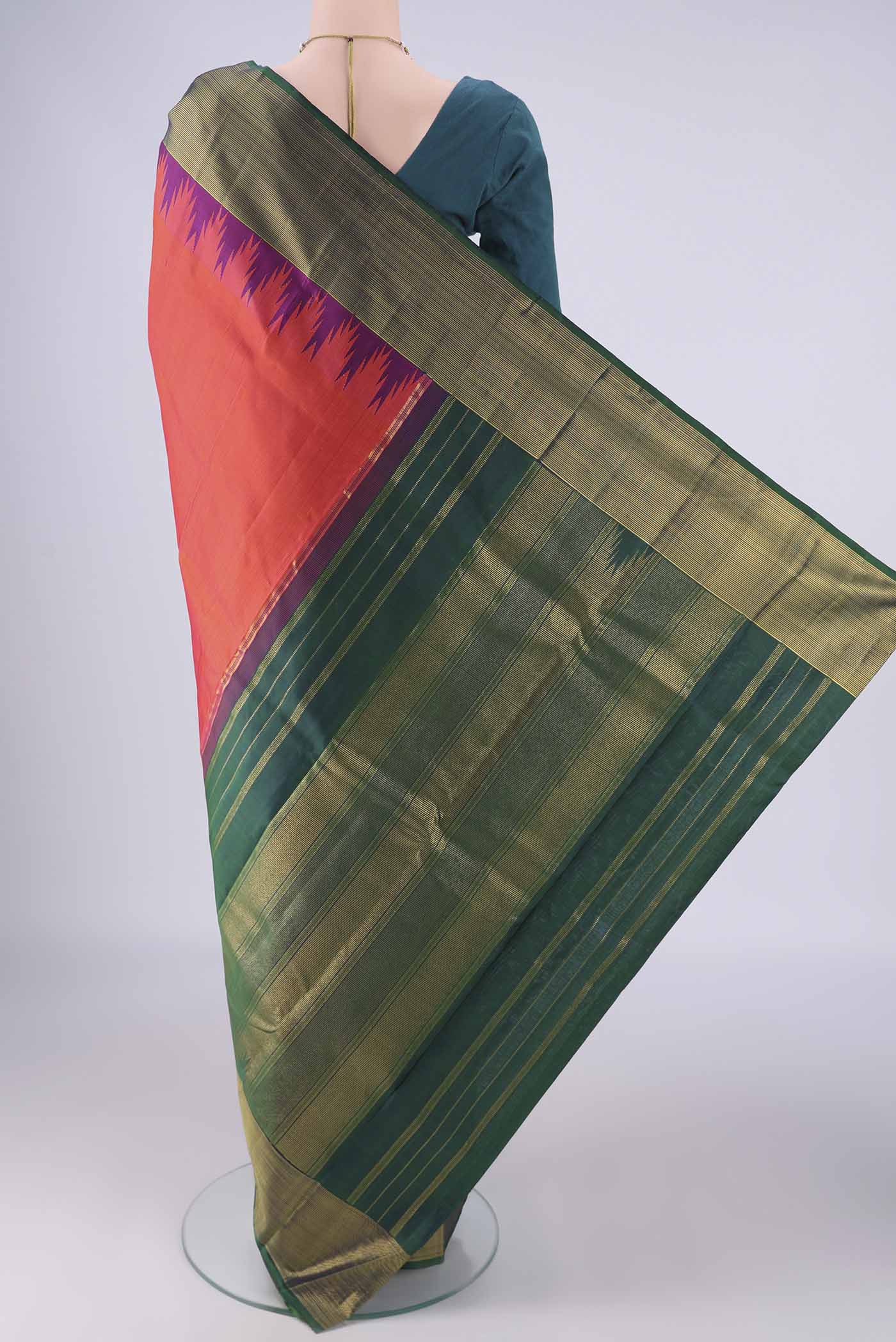 Flat view of Brick Orange Dual Tone Kanjivaram Silk Saree with Plain Body and Temple Border. 