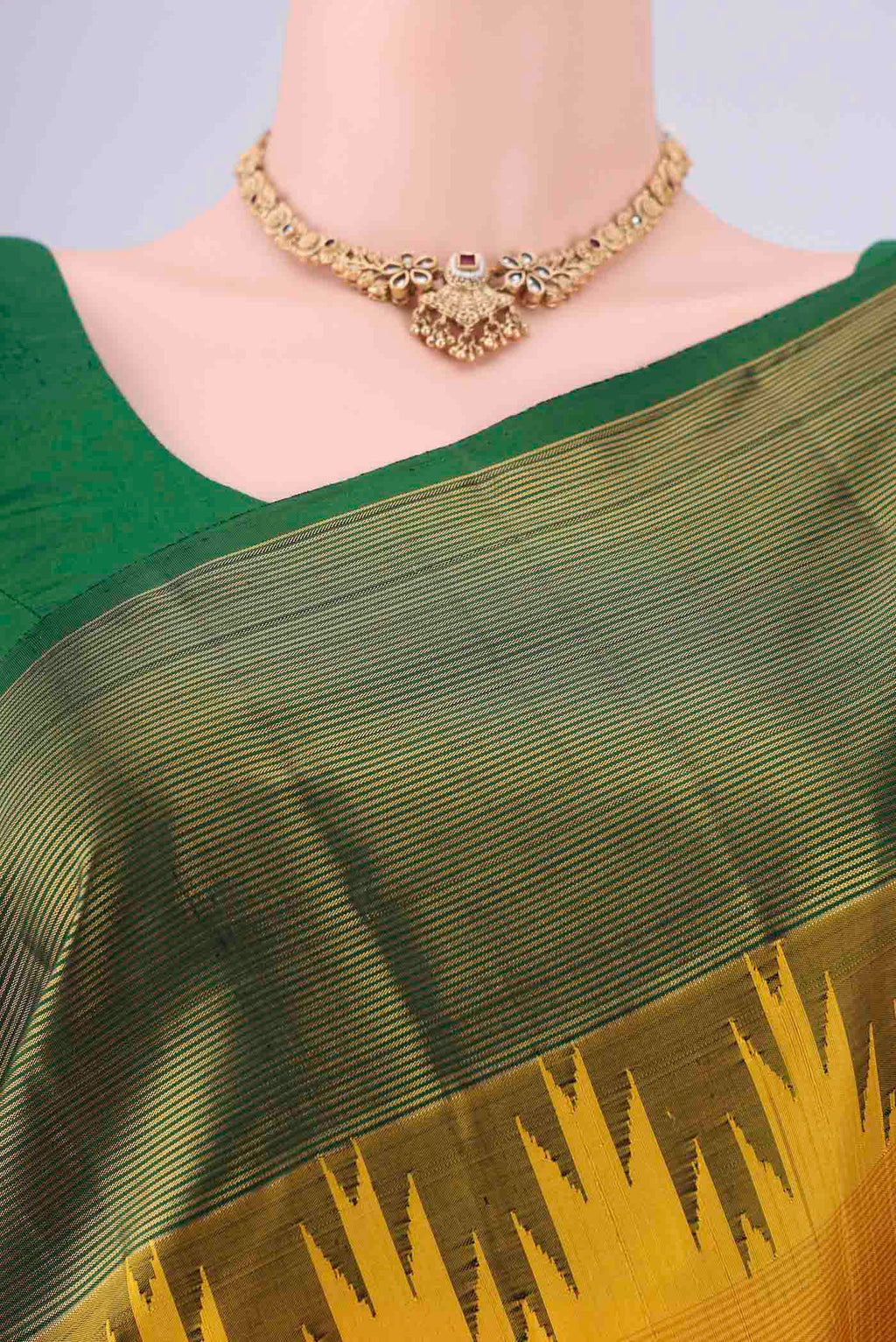 Border image of Yellow Kanjivaram Silk Saree with Plain Body and Temple Border. 