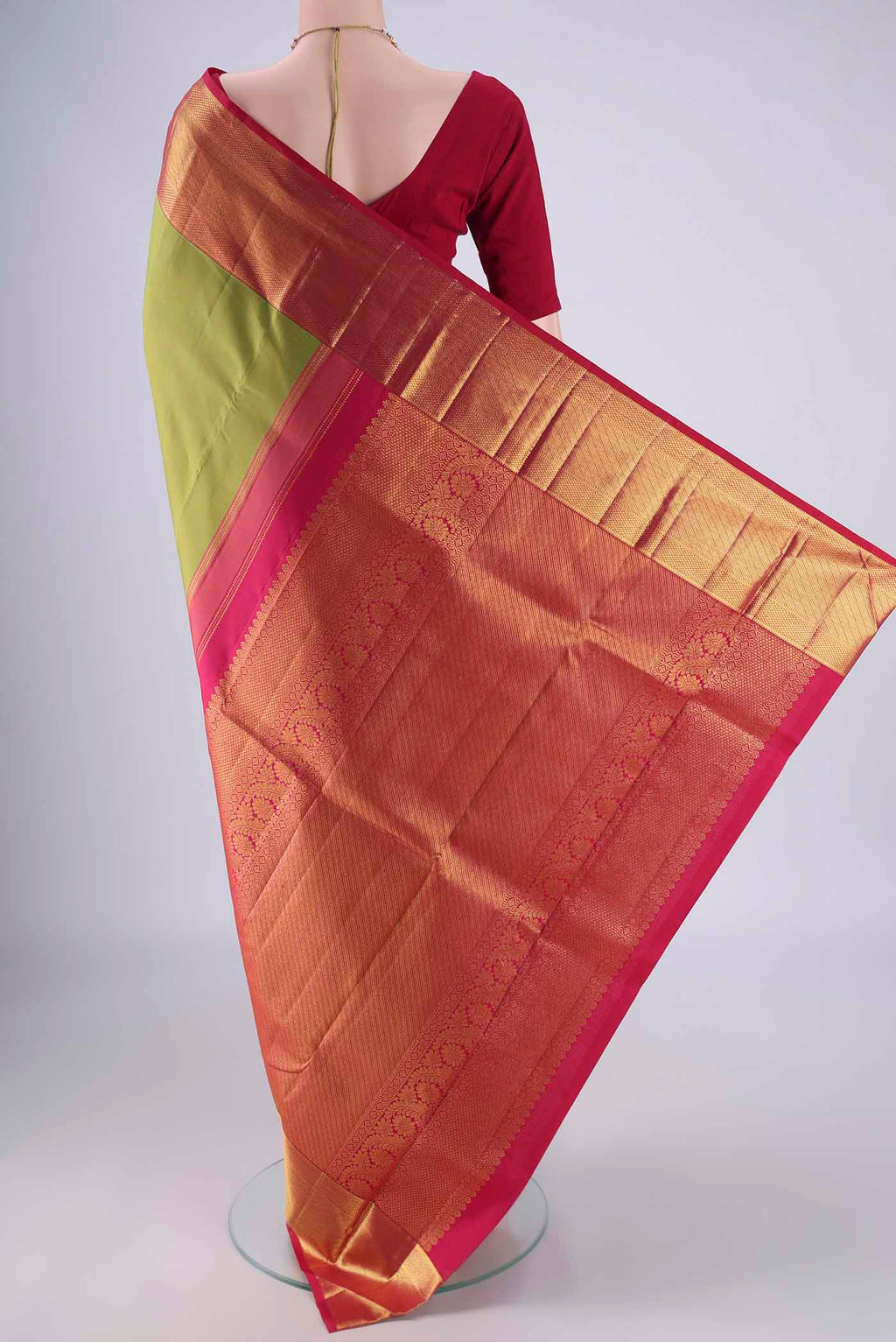 Flat view of Light Green Kanjivaram Silk Saree with Plain Body and Zari Border. 
