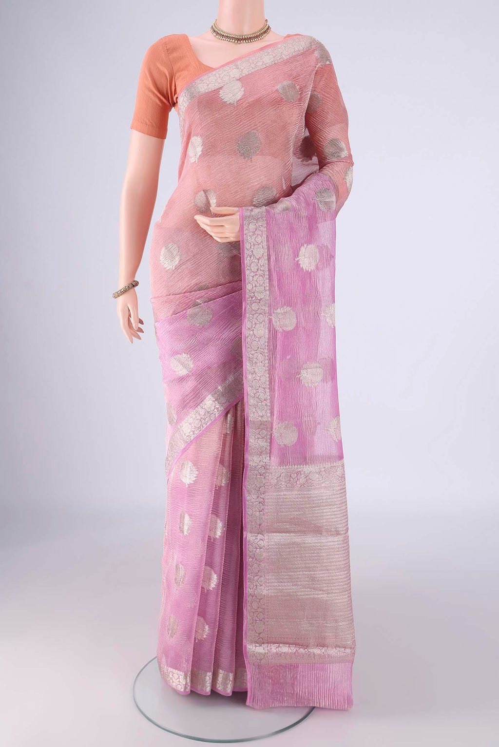 Peach Dual Tone Organza Silk Saree with Half And Half on the body and Zari Border.  displayed on a mannequin