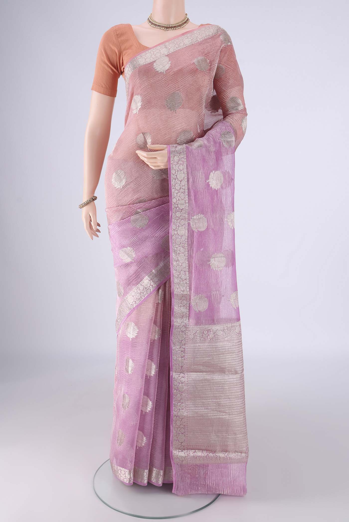 Peach Dual Tone Organza Silk Saree with Half And Half on the body and Zari Border.  displayed on a mannequin