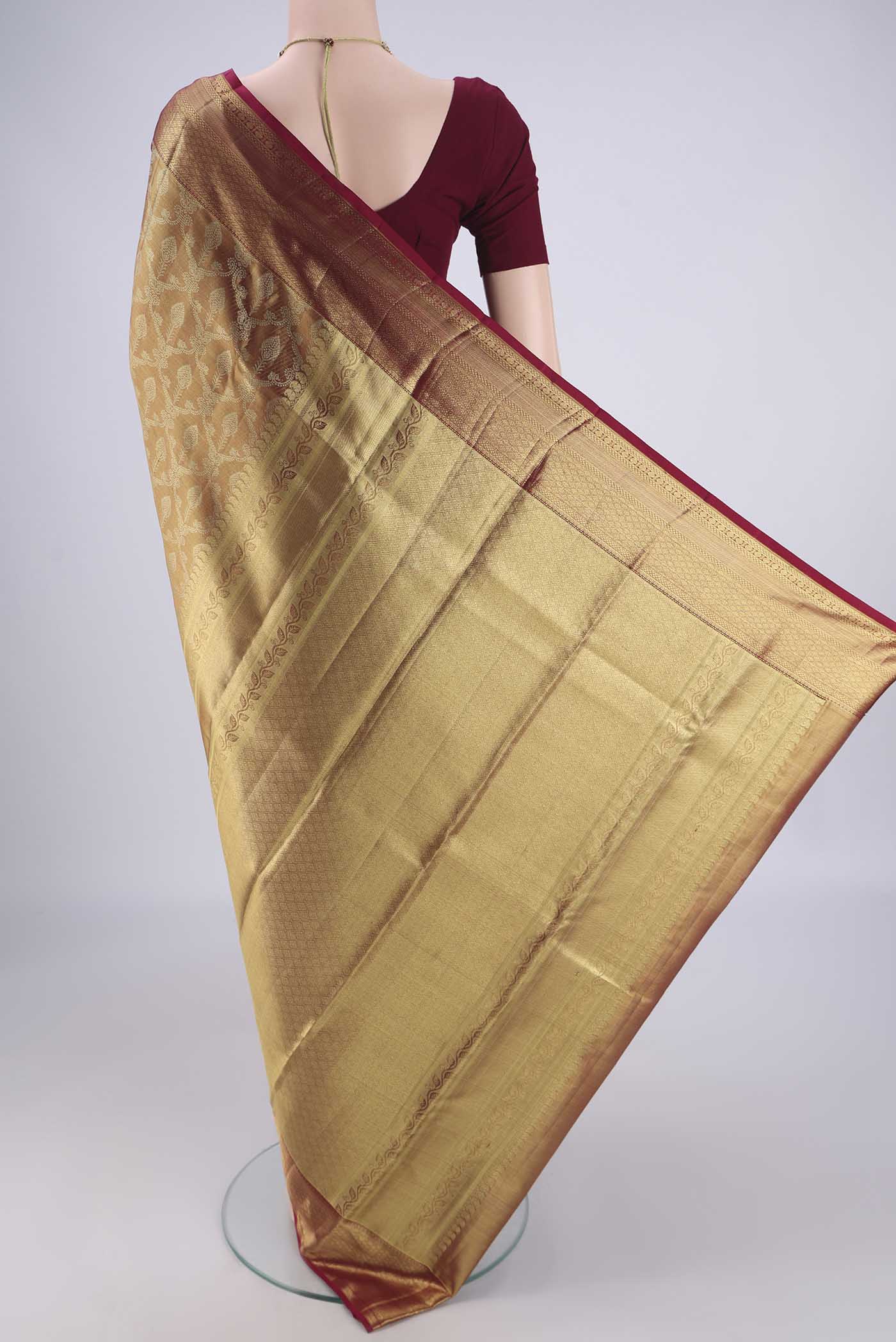 Flat view of Golden Dual Tone Kanchipuram Tissue Silk Saree with Zari Brocade on the body and Zari Border. 