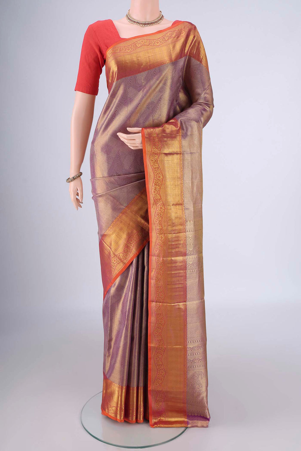 Lavender Dual Tone Kanchipuram Tissue Silk Saree with Zari Brocade on the body and Zari Border.  displayed on a mannequin