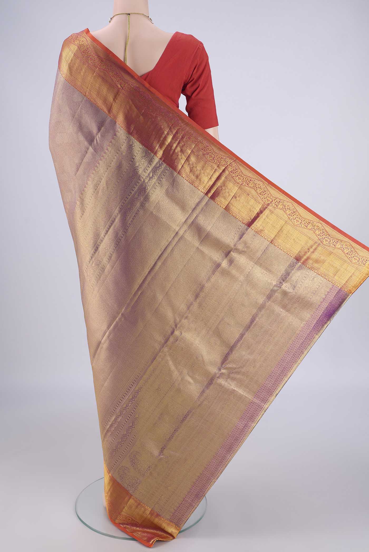 Flat view of Lavender Dual Tone Kanchipuram Tissue Silk Saree with Zari Brocade on the body and Zari Border. 