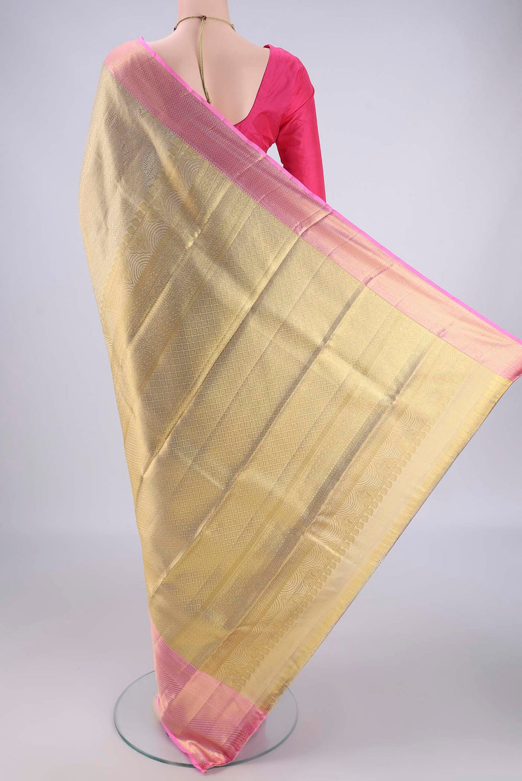 Flat view of Golden Kanchipuram Tissue Silk Saree with Zari Brocade on the body and Zari Border. 