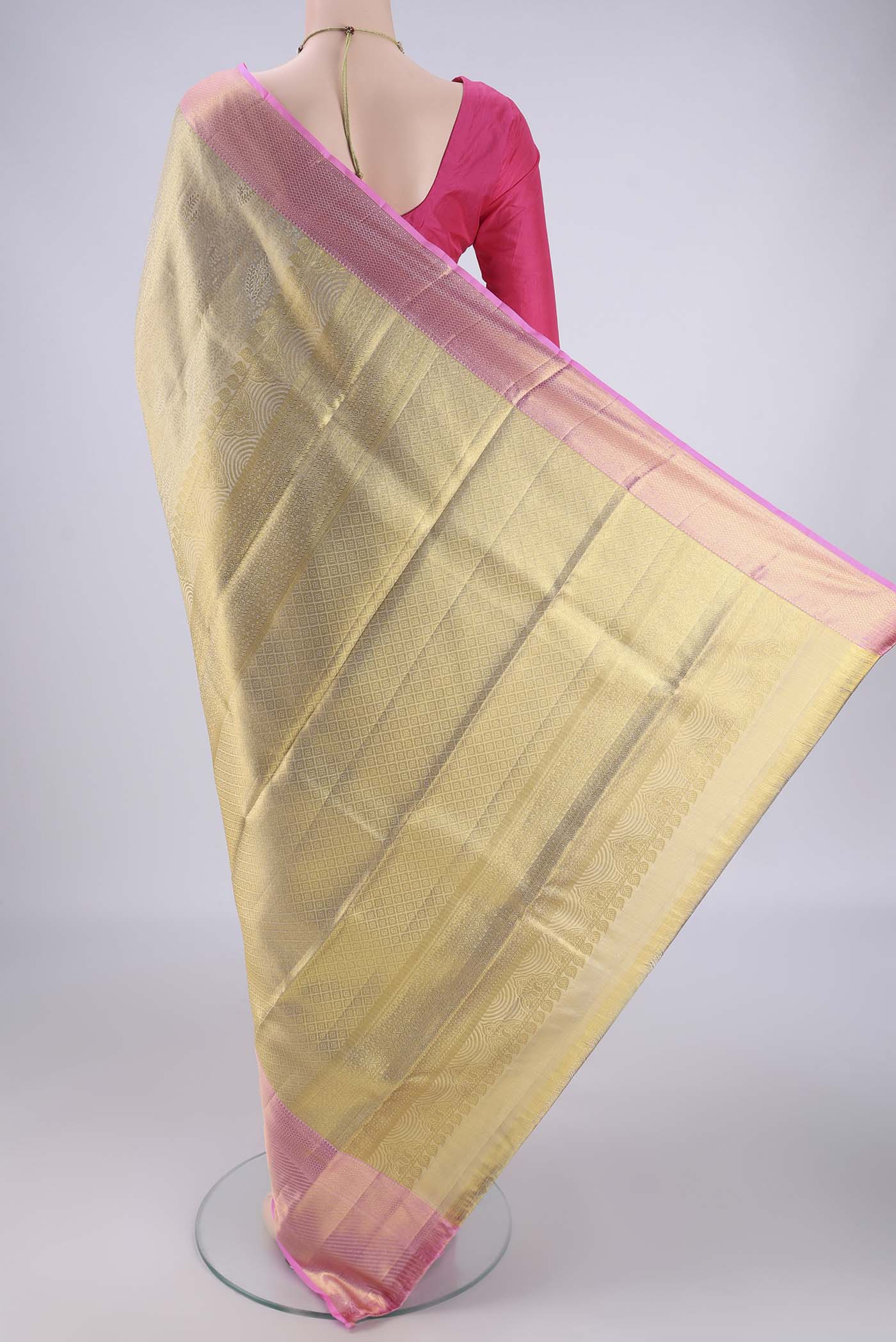 Flat view of Golden Kanchipuram Tissue Silk Saree with Zari Brocade on the body and Zari Border. 