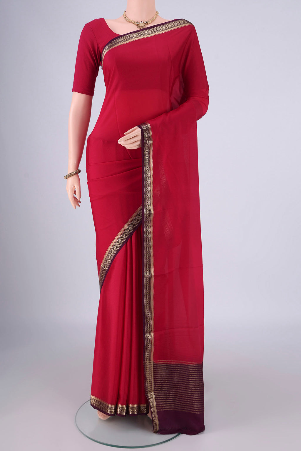 Dark Pink Mysore Crepe Saree with Plain Body and Zari Border.  displayed on a mannequin
