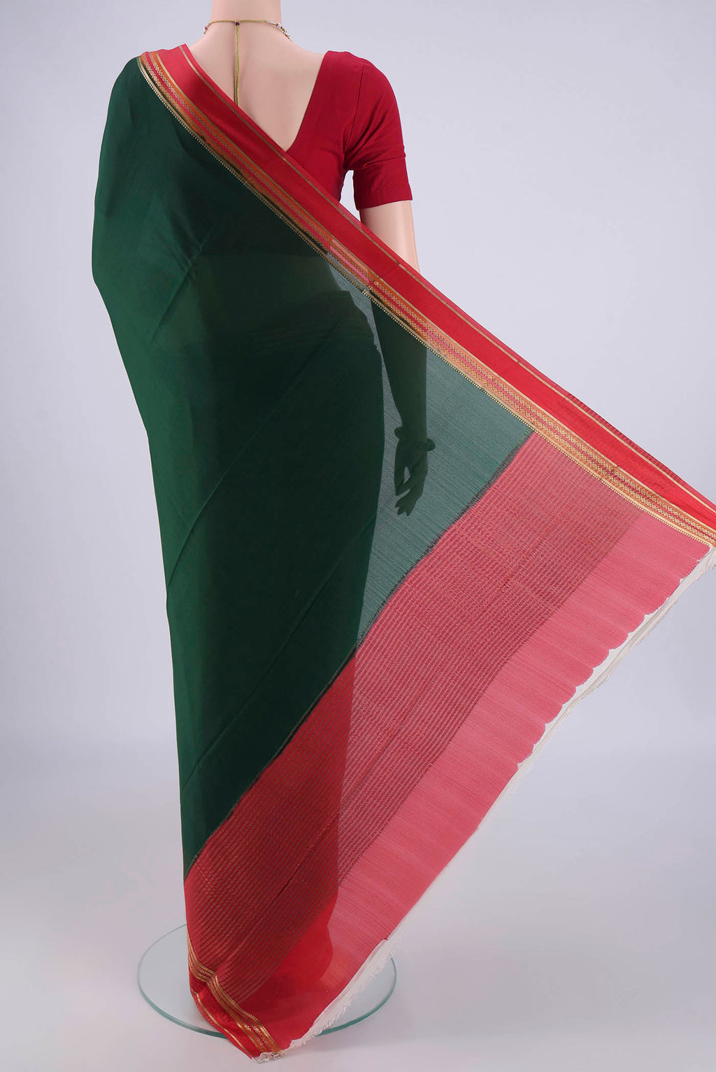 Flat view of Bottle Green Mysore Crepe Saree with Plain Body and Zari Border. 