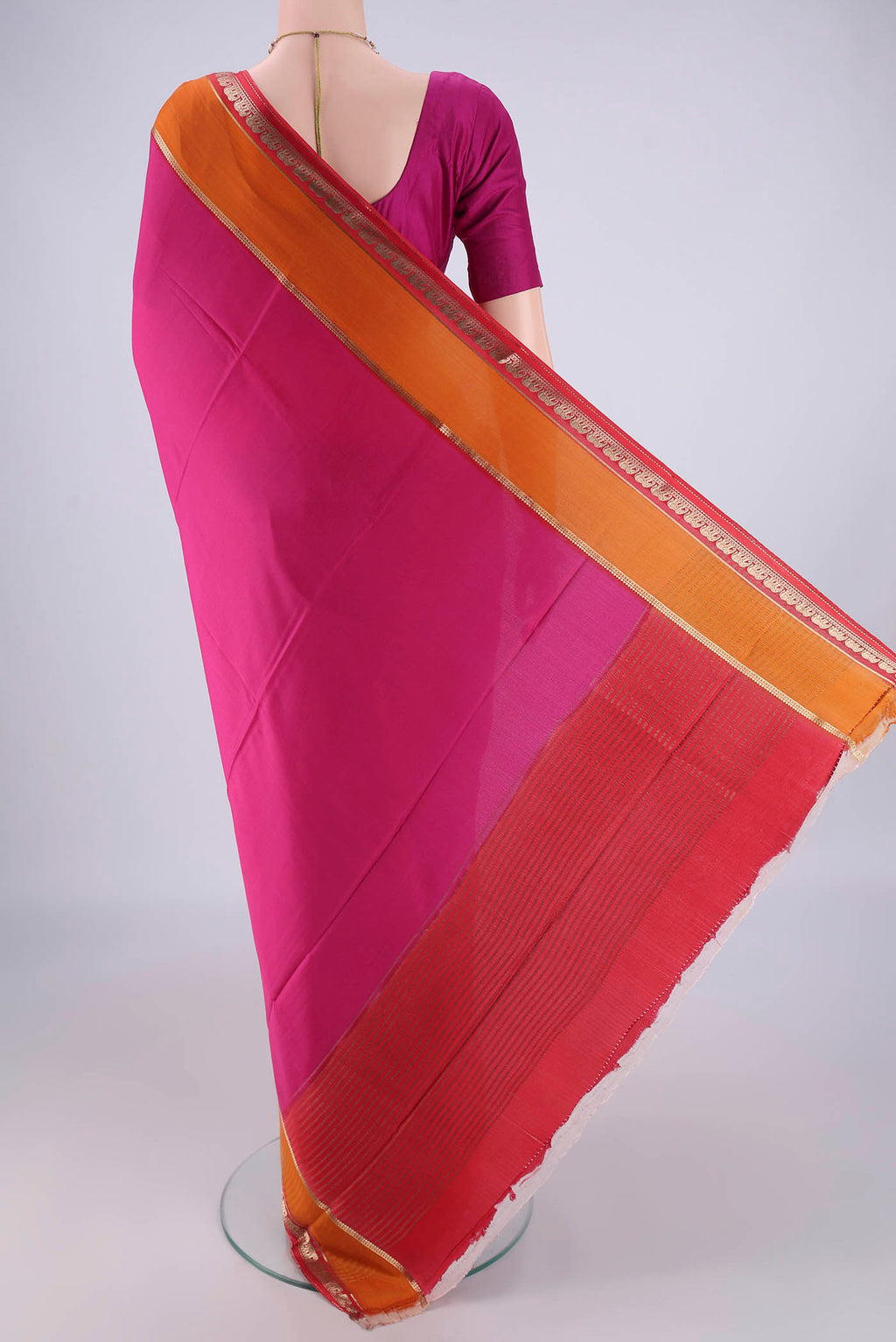 Flat view of Rani Pink Mysore Crepe Saree with Plain Body and Zari Border. 