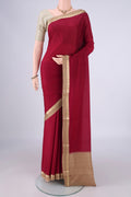 Maroon Mysore Crepe Saree with Plain Body and Zari Border.  displayed on a mannequin