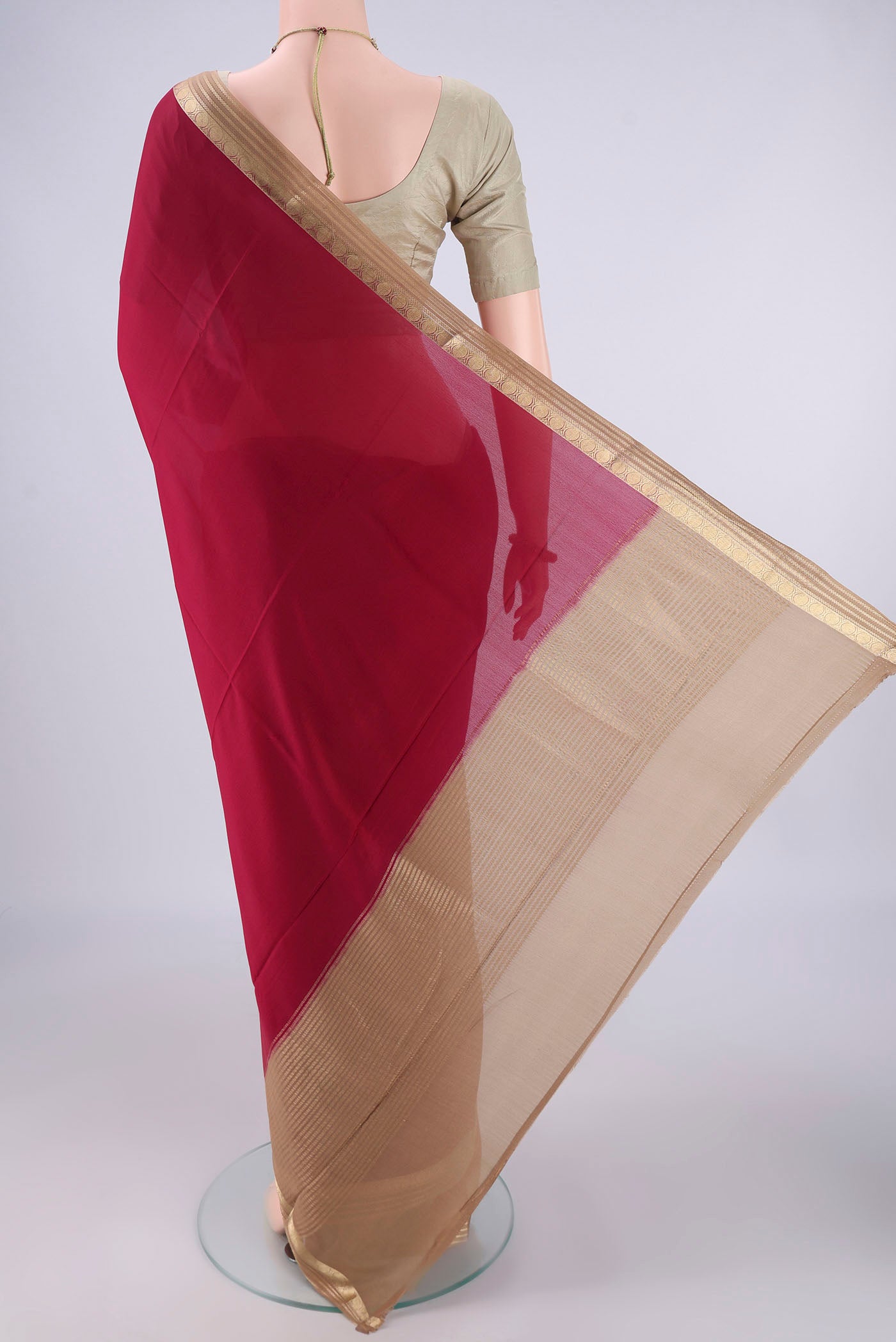 Flat view of Maroon Mysore Crepe Saree with Plain Body and Zari Border. 