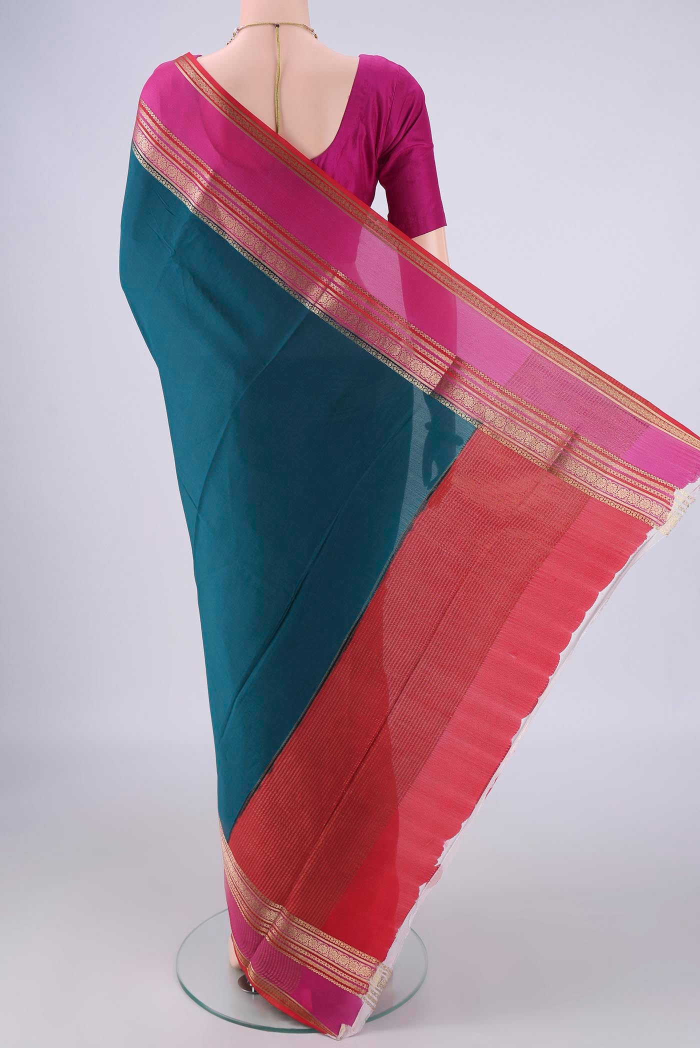 Flat view of Teal Mysore Crepe Saree with Plain Body and Zari Border. 