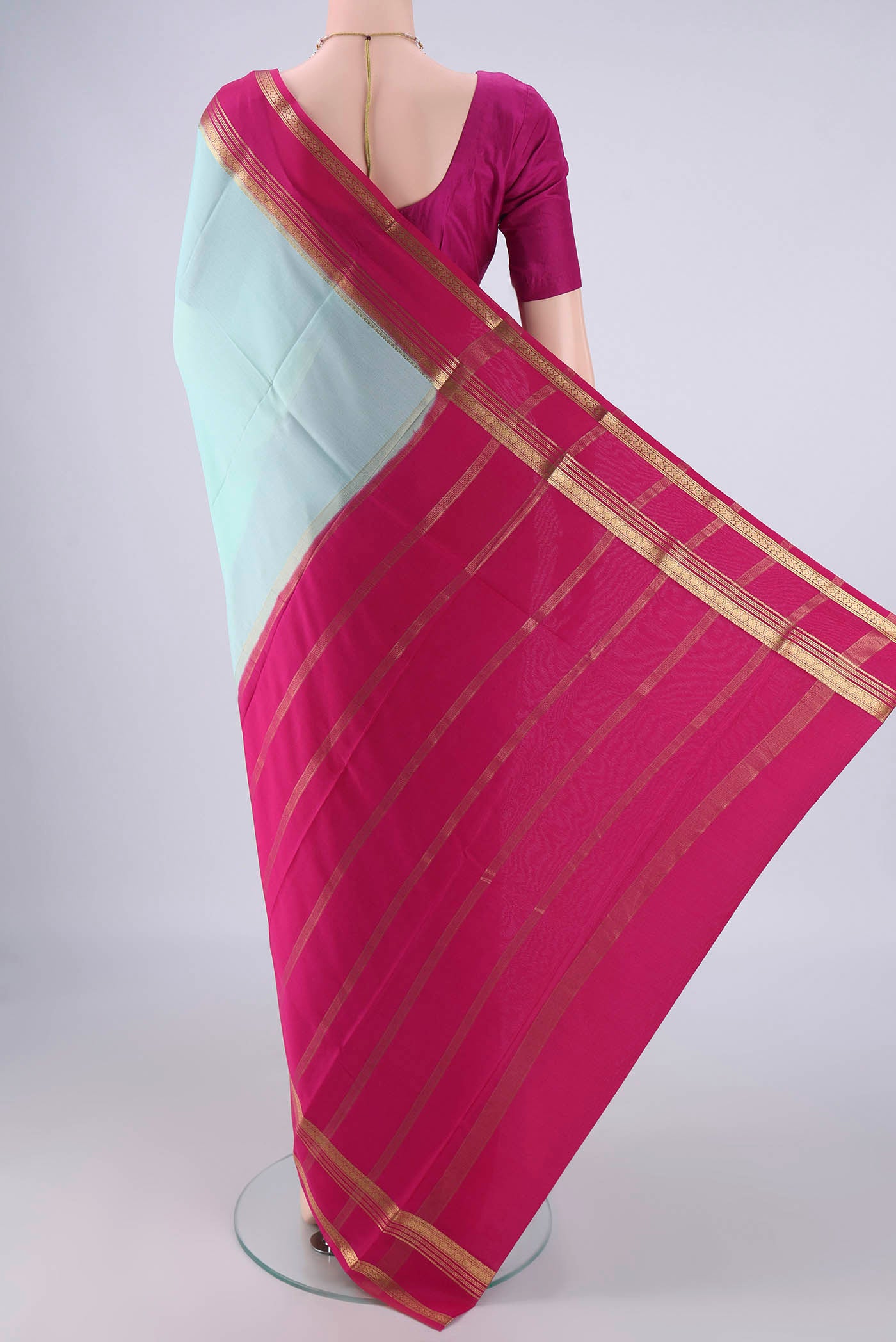 Flat view of Light Blue Mysore Crepe Saree with Plain Body and Zari Border. 