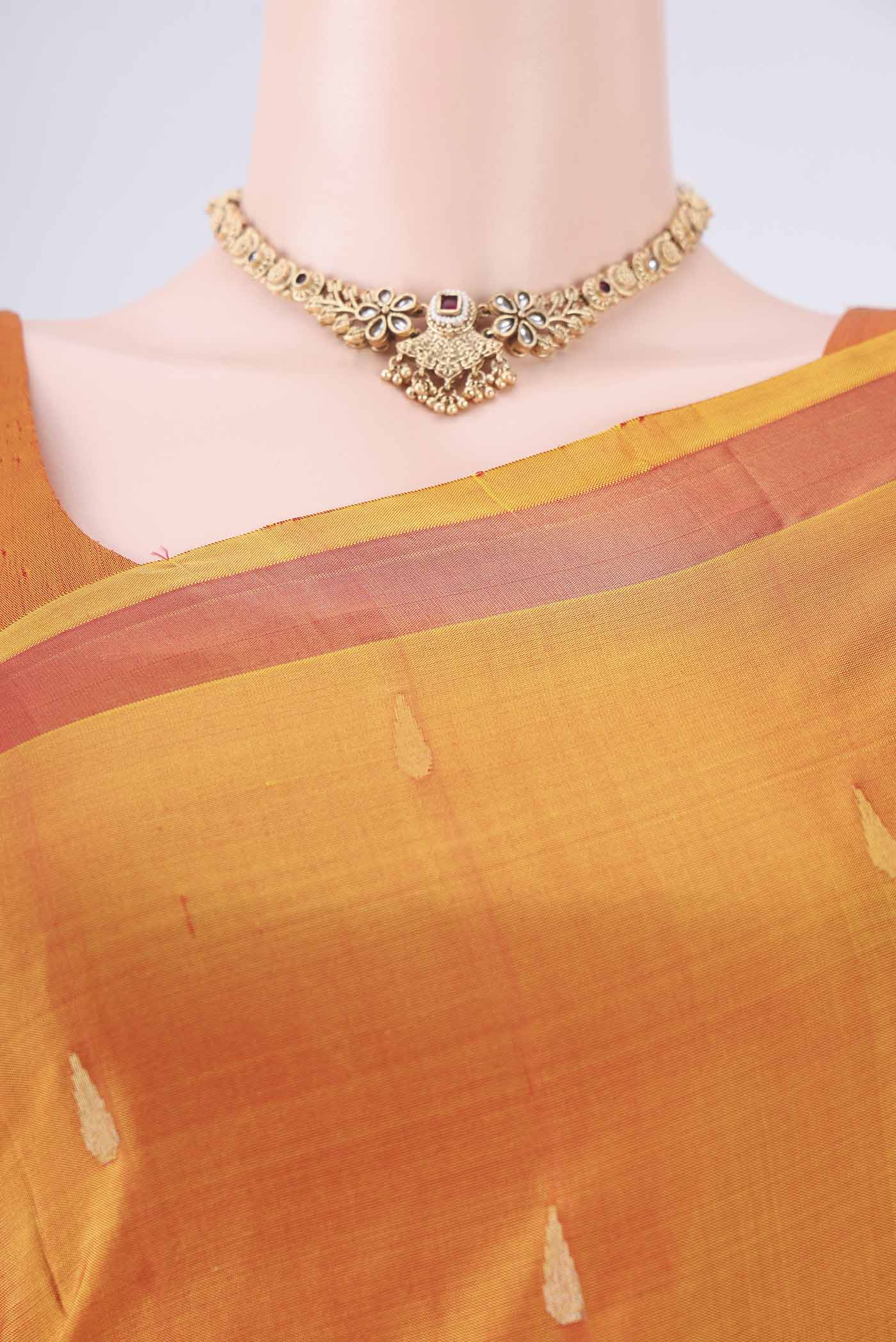 Border image of Mustard Uppada Silk Saree with Zari Butta on the body and Zari Border. 