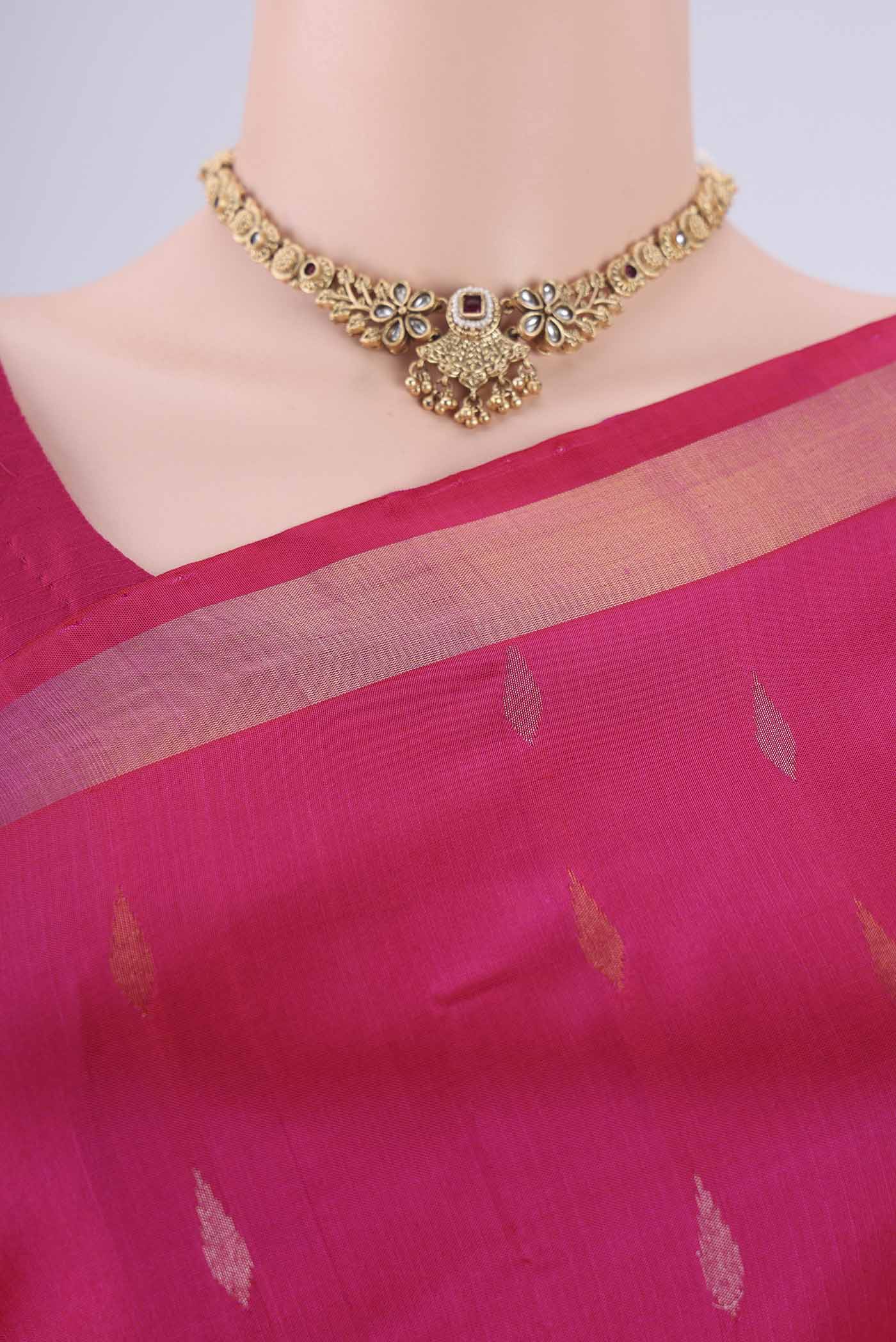 Border image of Rani Pink Uppada Silk Saree with Zari Butta on the body and Zari Border. 