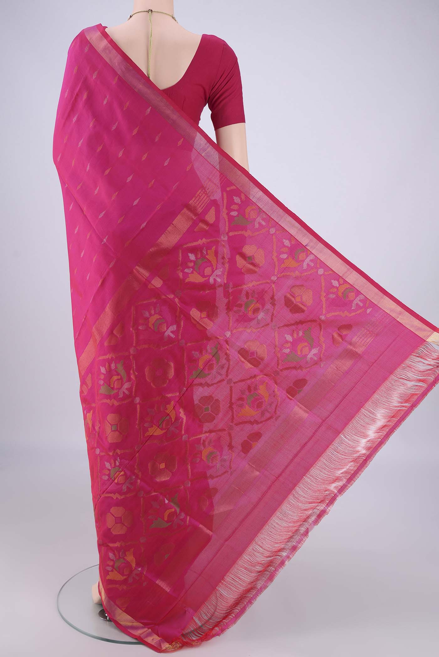 Flat view of Rani Pink Uppada Silk Saree with Zari Butta on the body and Zari Border. 