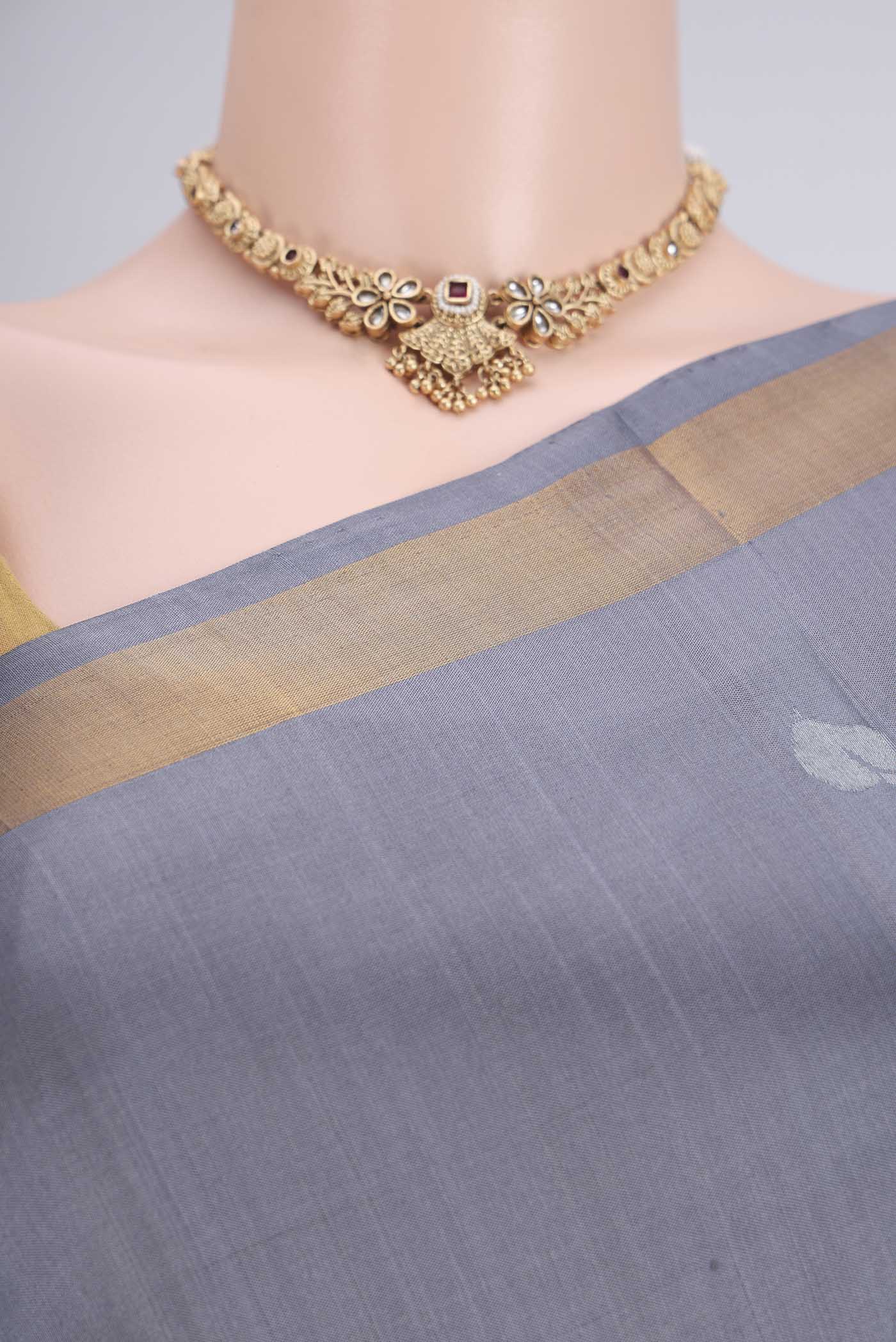 Border image of Grey Uppada Silk Saree with Zari Butta on the body and Zari Border. 