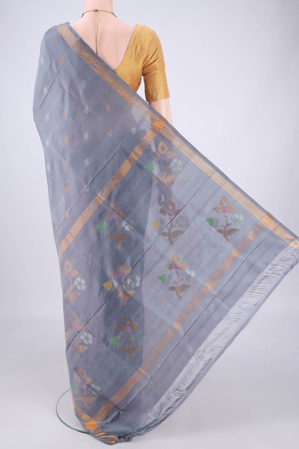 Flat view of Grey Uppada Silk Saree with Zari Butta on the body and Zari Border. 